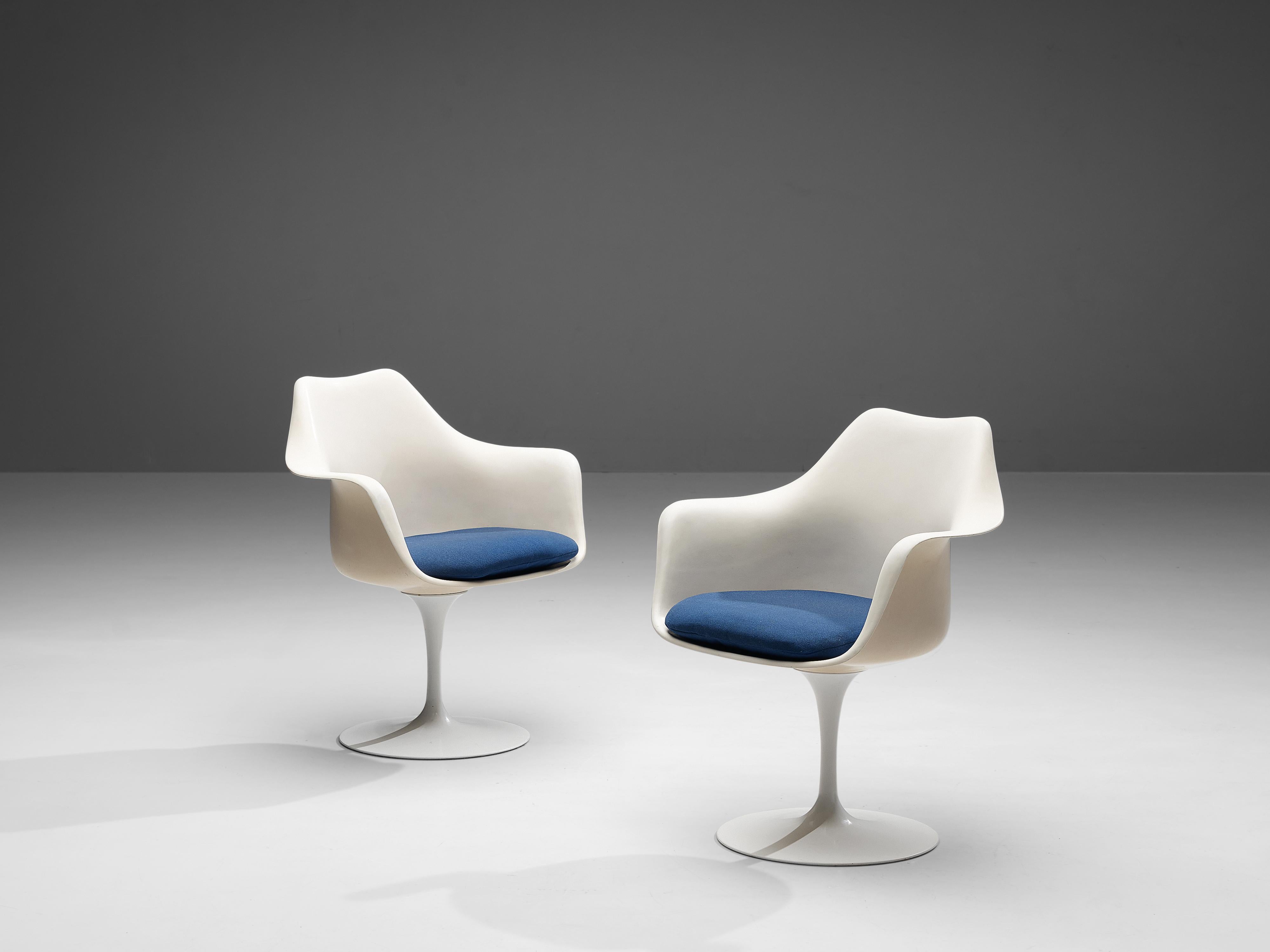 Eero Saarinen for Knoll, pair of 'Tulip' armchairs, fiberglass, aluminum and fabric, United States, 1955-56.

These two armchairs with blue fabric seats are from the 'Tulip' collection and were designed by Eero Saarinen for Knoll International.