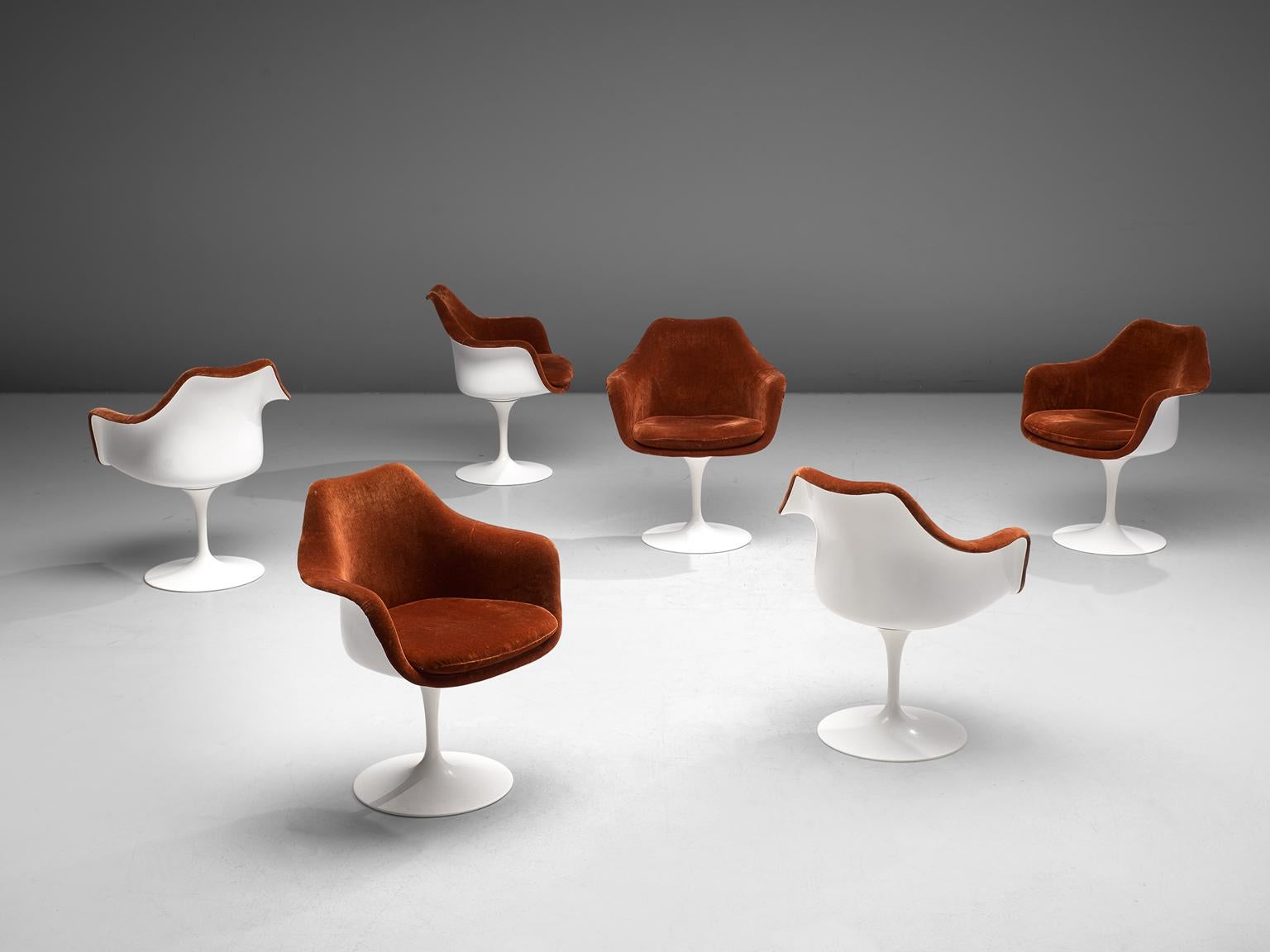 Eero Saarinen for Knoll, set of 6 'Tulip' armchairs, fiberglass, aluminum and velvet, United States, 1955-56.

These six armchairs with red-brown velvet seats are from the Tulip collection and were designed by Eero Saarinen for Knoll