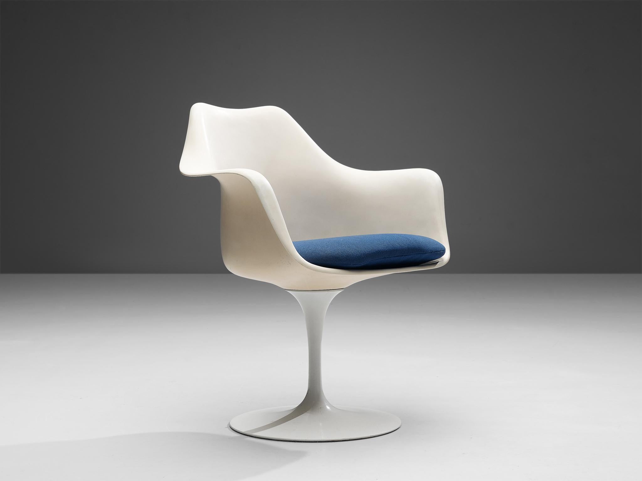 Eero Saarinen for Knoll, 'Tulip' armchair, fiberglass, aluminum and fabric, United States, 1955-56.

This armchair with blue fabric seat is from the 'Tulip' collection and was designed by Eero Saarinen for Knoll International. This iconic tulip
