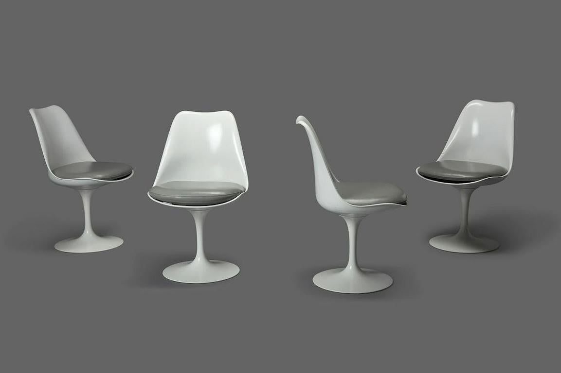 Set of four 'Tulip' chairs, model no. 150, 2000s
Molded fiberglass, painted aluminum, vinyl. Manufactured by Knoll, USA.

Undersides of bases with Knoll Studio metal label and molded with 