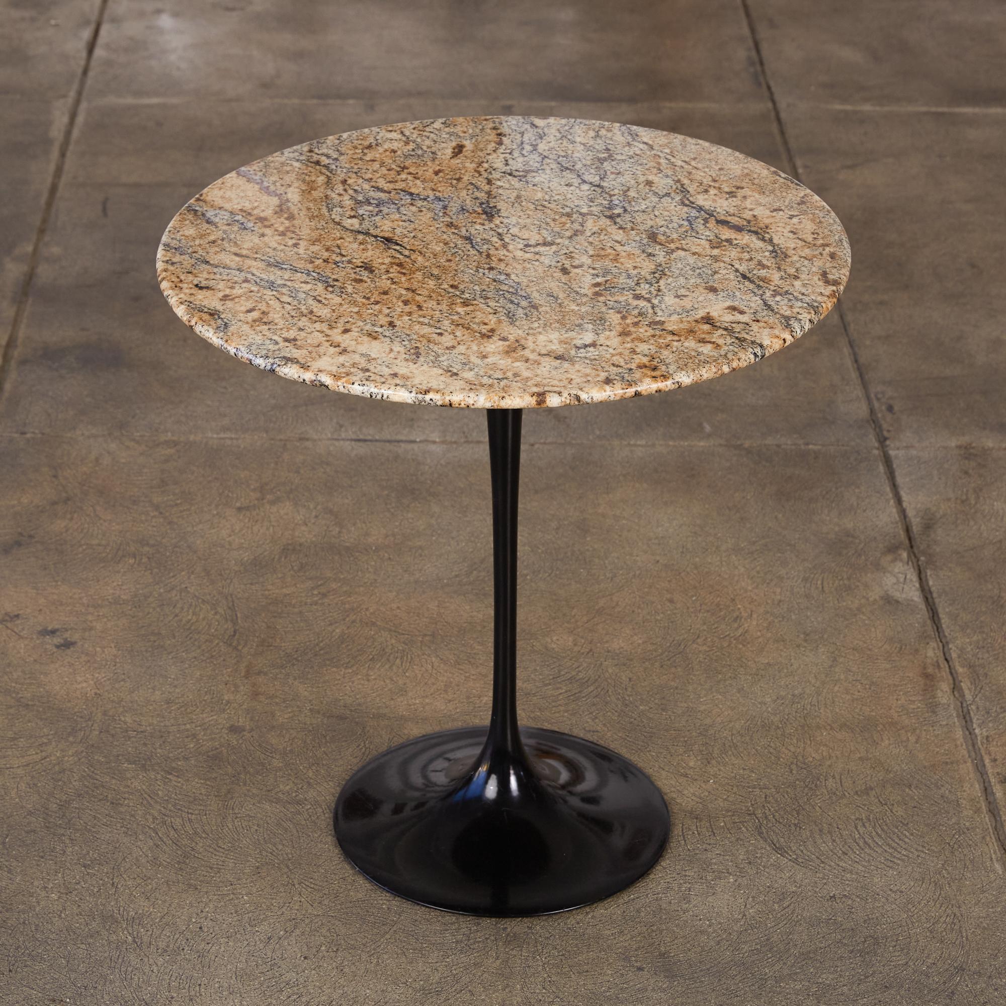 One of Saarinen’s most enduring designs, part of the Pedestal Collection and designed in 1957, this side table features a black heavy molded cast aluminum base with a round light brown and black veined granite top.

Dimensions: 20” diameter x