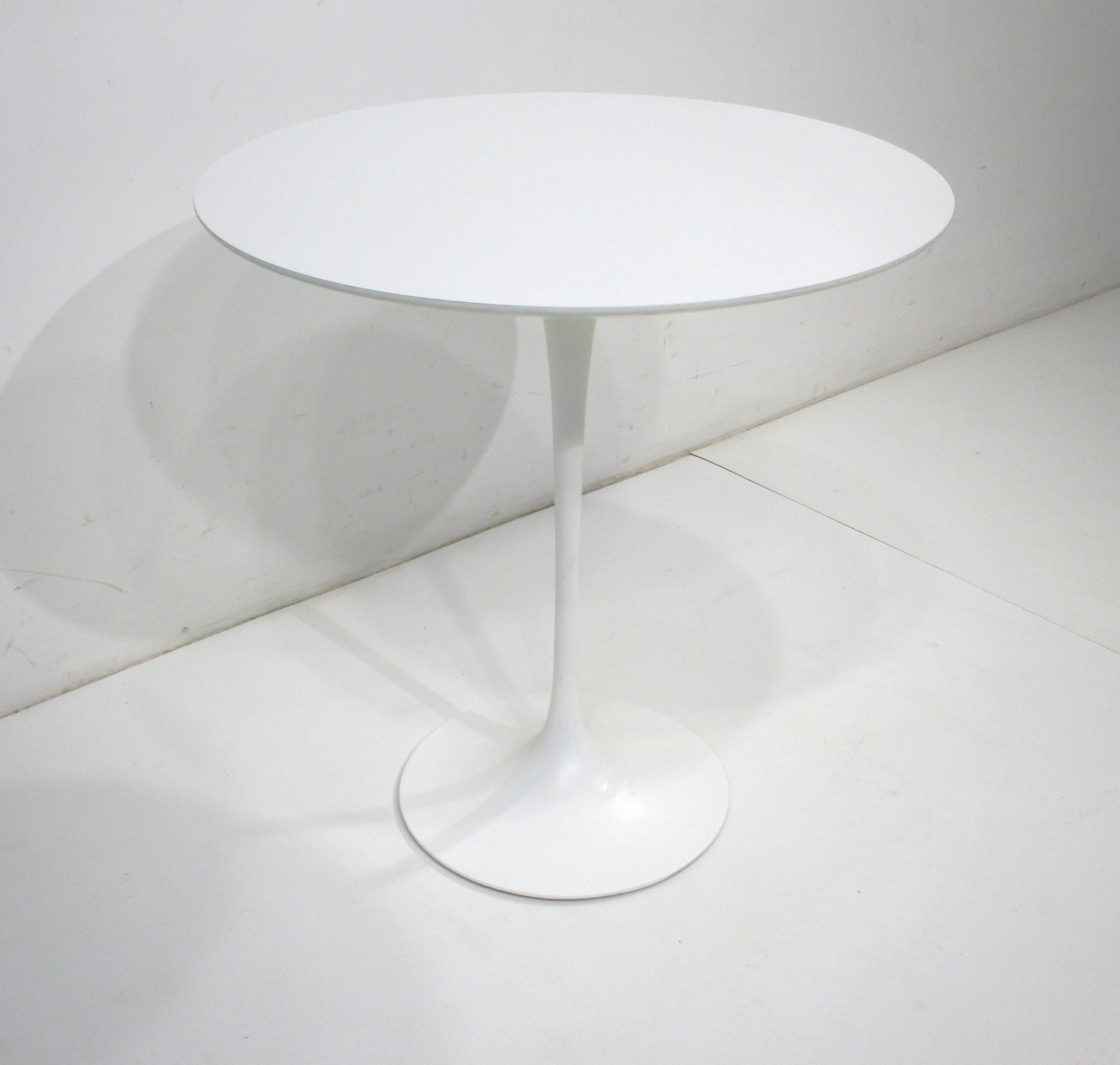 A very fine sculptural tulip side table with a bigger sized 20
