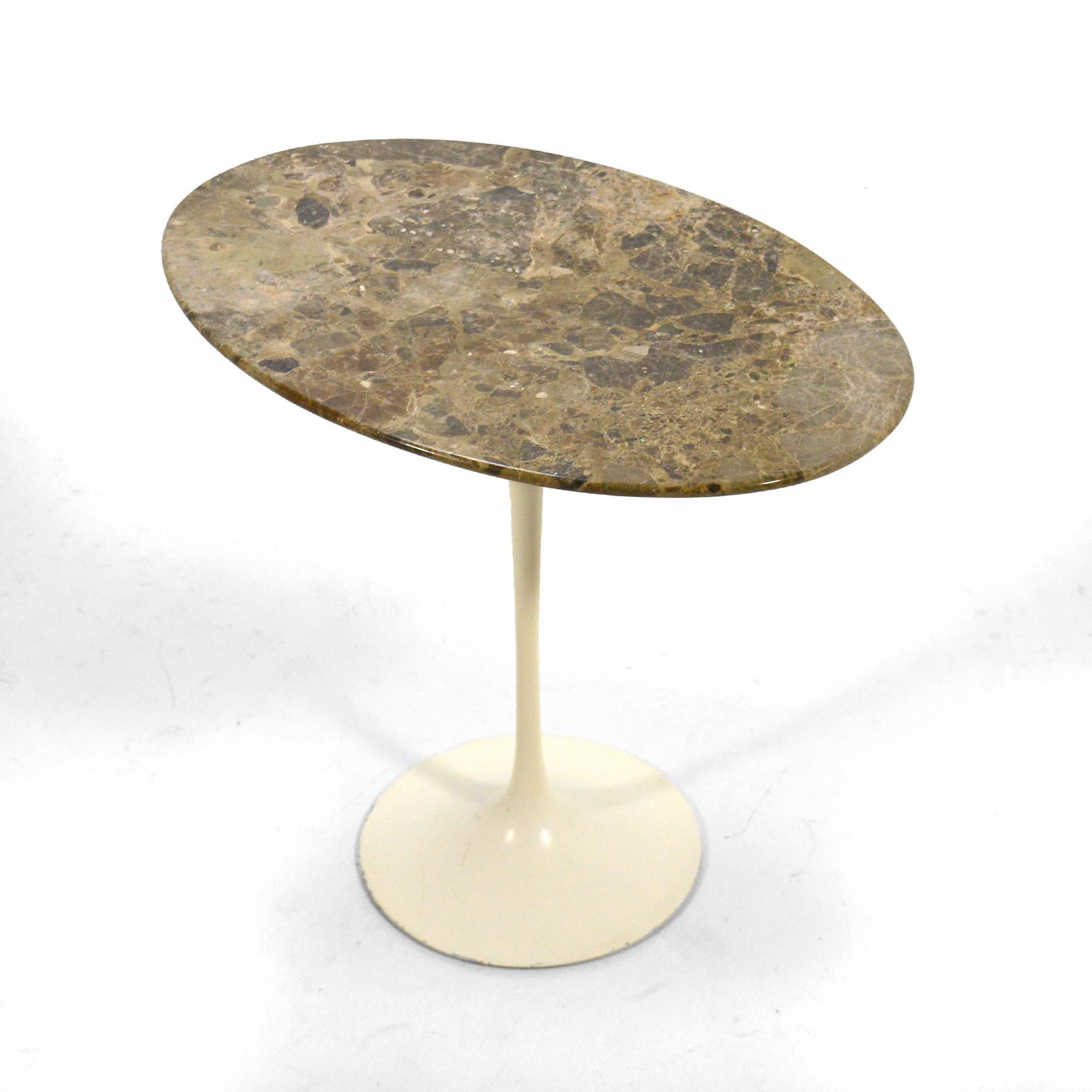 This rare early Saarinen Tulip side table by Knoll has an elliptical top of stunning stone which has a color and pattern that reminds us of a lunar landscape. This exceptional example has the perfect patina from age.