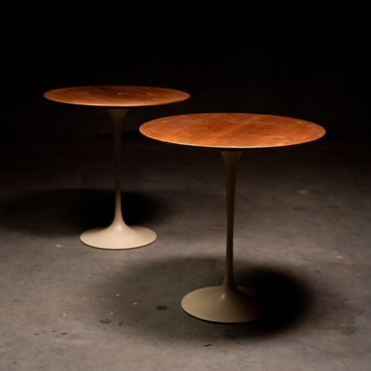 A nice pair of Eero Saarinen tulip side table for Knoll. Walnut tops and cast iron bases with original powder coat. 
PRICER PER TABLE 

Tables were acquired in a private collection outside Seattle. Restoration free, we would prefer to sell as a pair