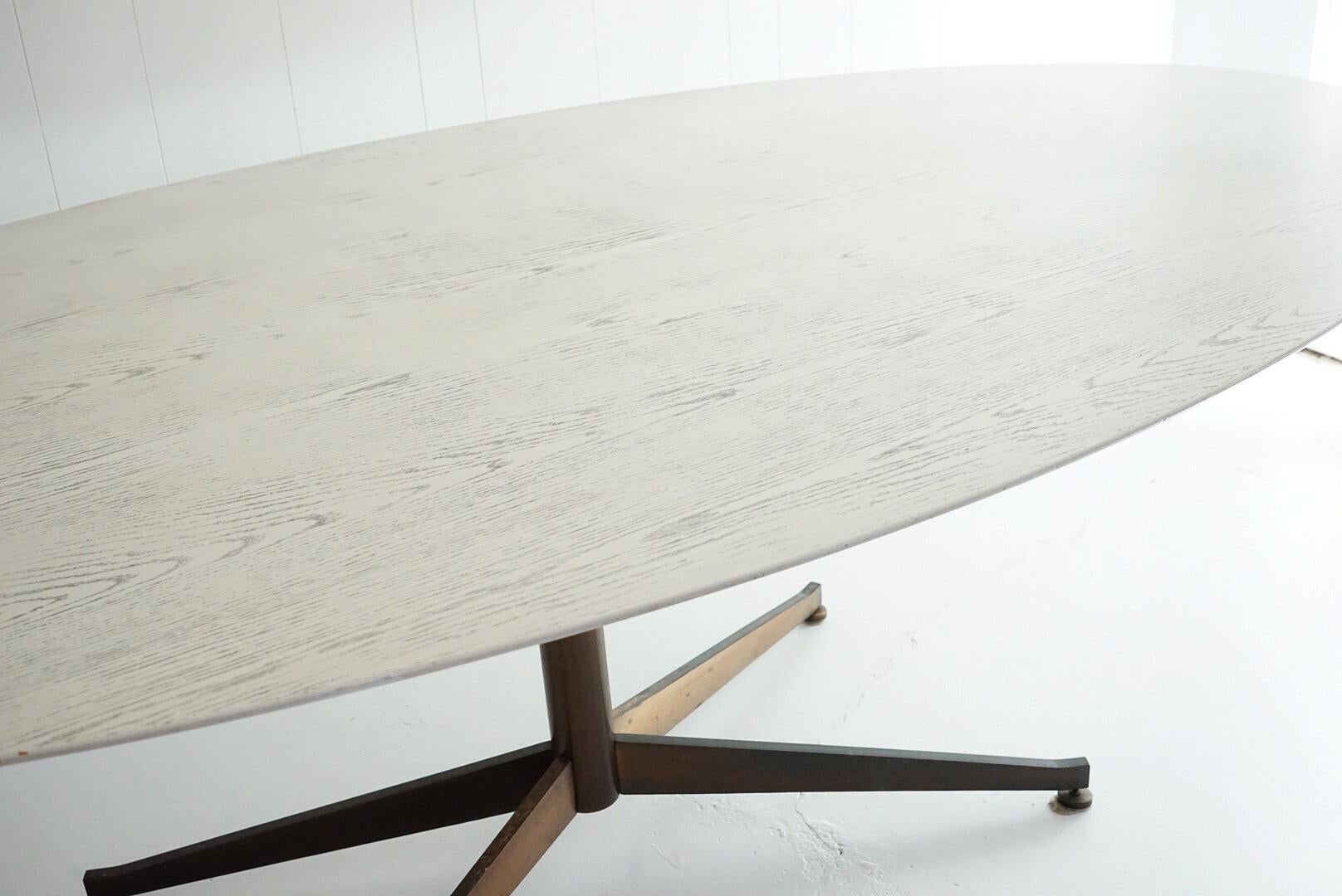 Rare 96’ tulip dining table by Eero Saarinen for Knoll
tabletop is white oak that has been bleached and cerused
white with charcoal grain 
Vintage base is a patinated bronze, brown color base similar to Florence Knoll table base 
Table has