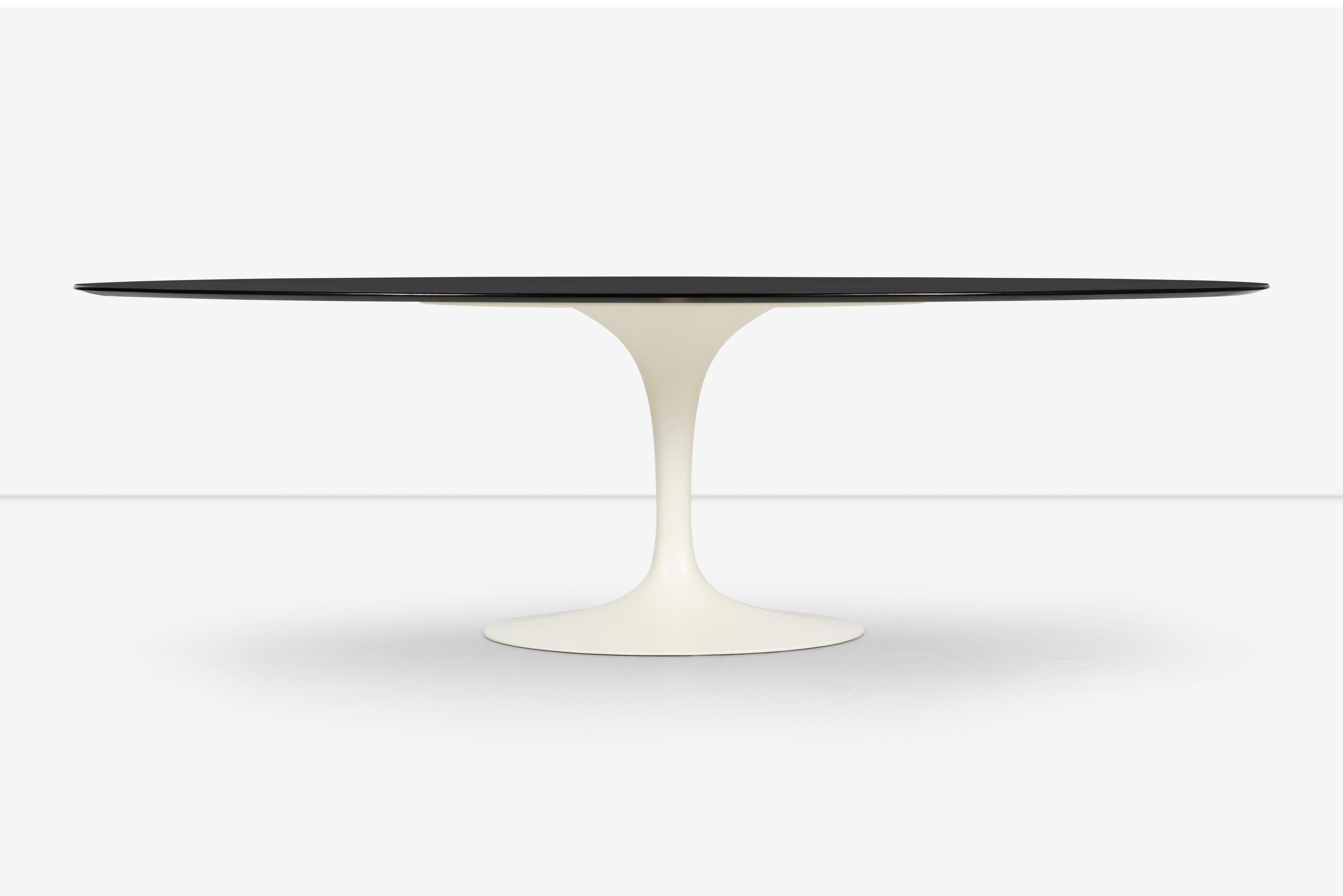 The Eero Saarinen Tulip Table for Knoll is a classic and iconic piece of furniture that has been a mainstay in modern design since its creation in the 1950s. The table's distinctive design features a sleek and elegant cream colored pedestal base