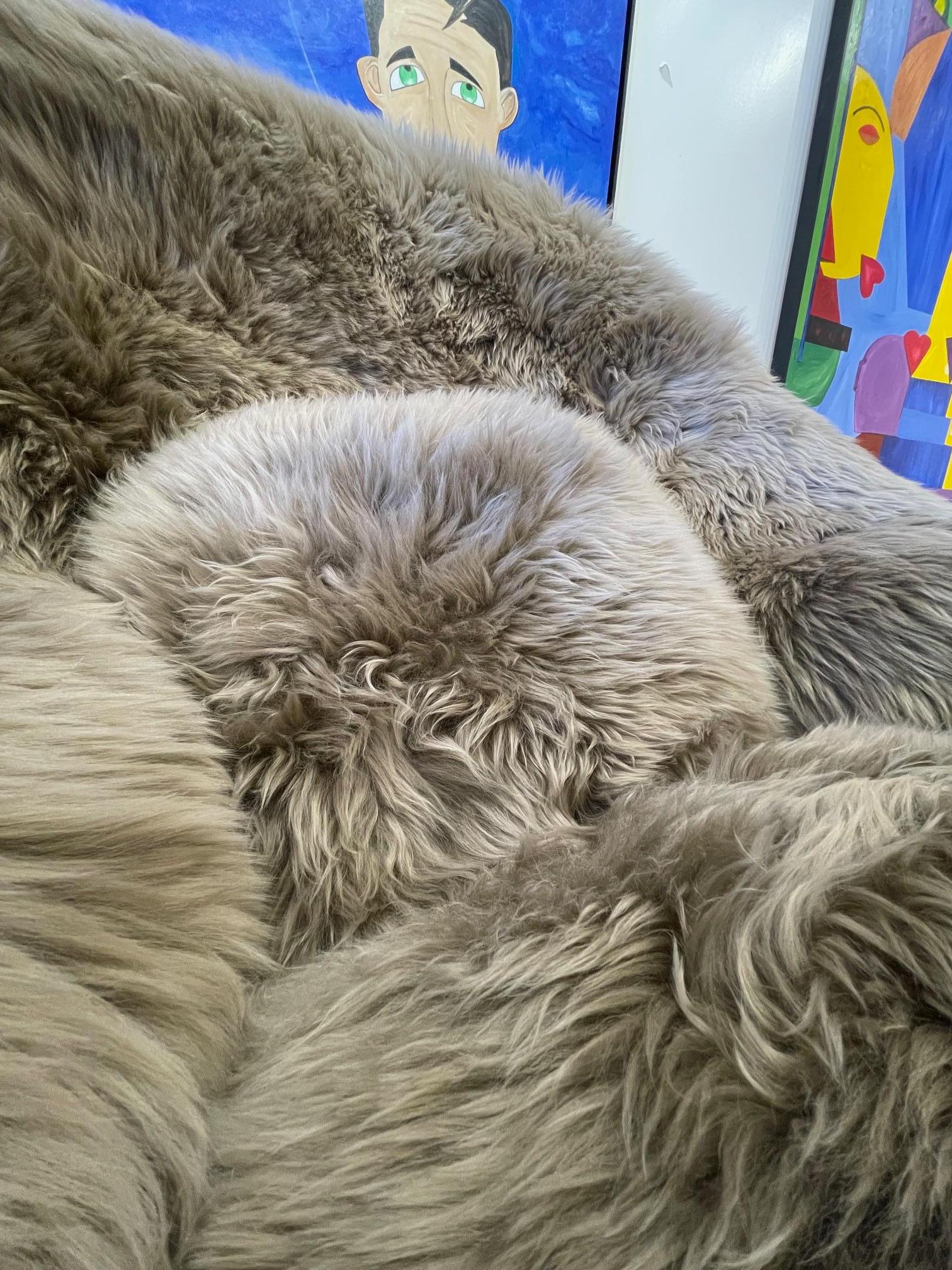 Steel Eero Saarinen Womb Chair and Ottoman in New Zealand Taupe Sheepskin For Sale