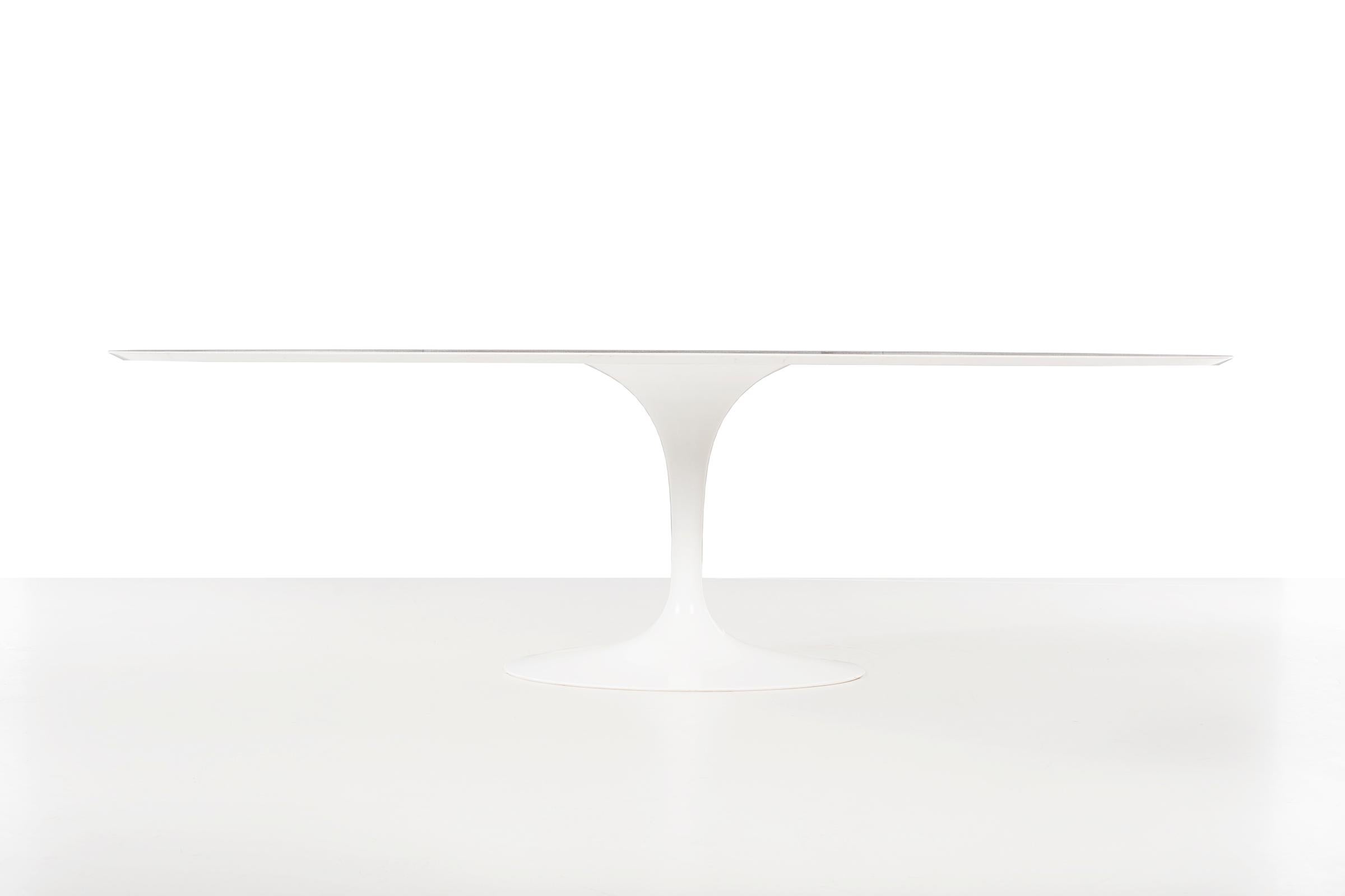Vintage Knoll Tulip dining table, elliptical beveled white Thassos marble. 
Cast base with stable concrete filled stem. 
Table underside [Knoll International].

 