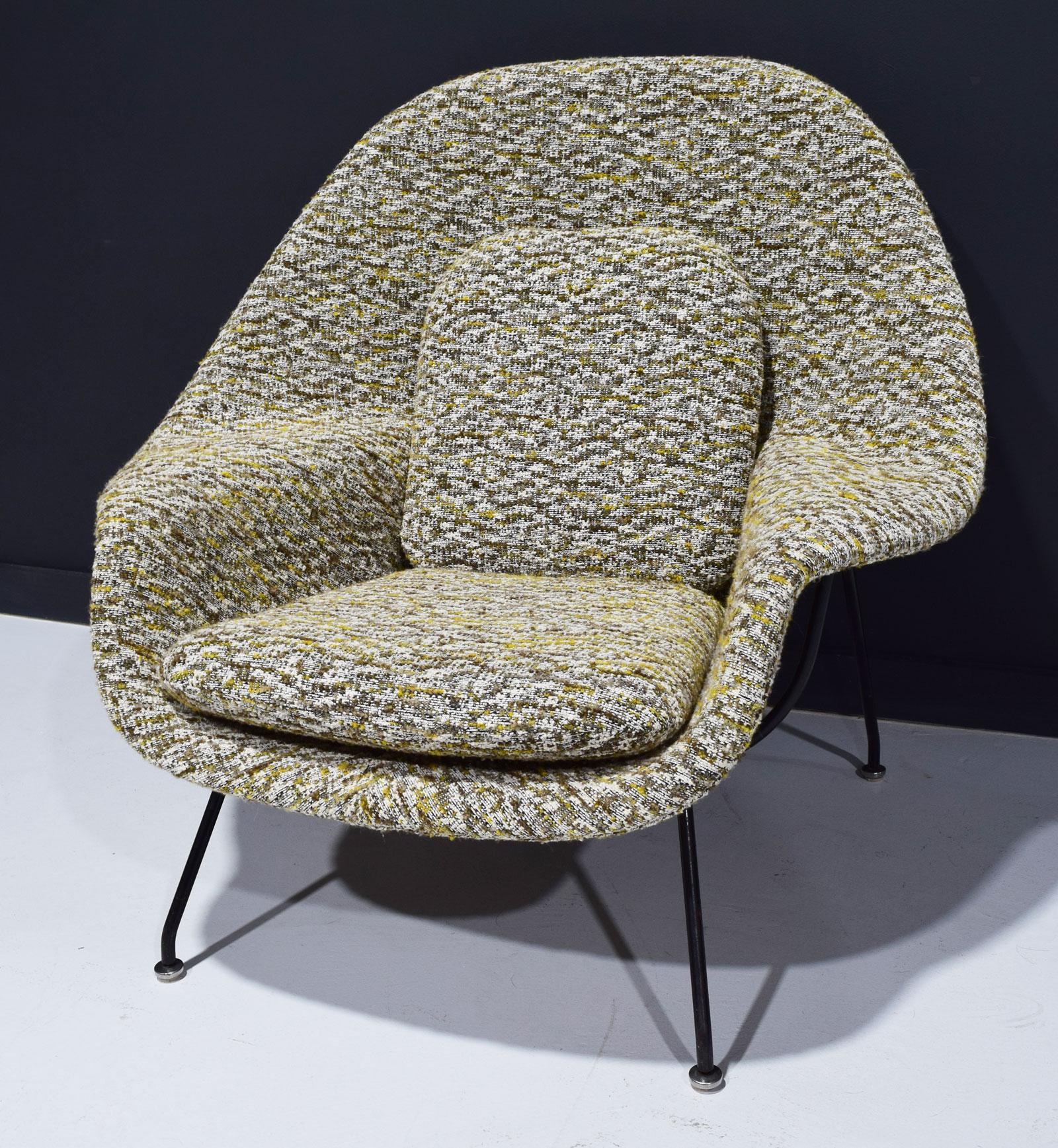 An iconic Eero Saarinen for Knoll womb chair newly upholstered in a very high-quality French bouclé. The colors include yellow/gold, sienna browns and white. This pairs beautifully with one of the Dunbar sofas we have reupholstered in yellow/dijon