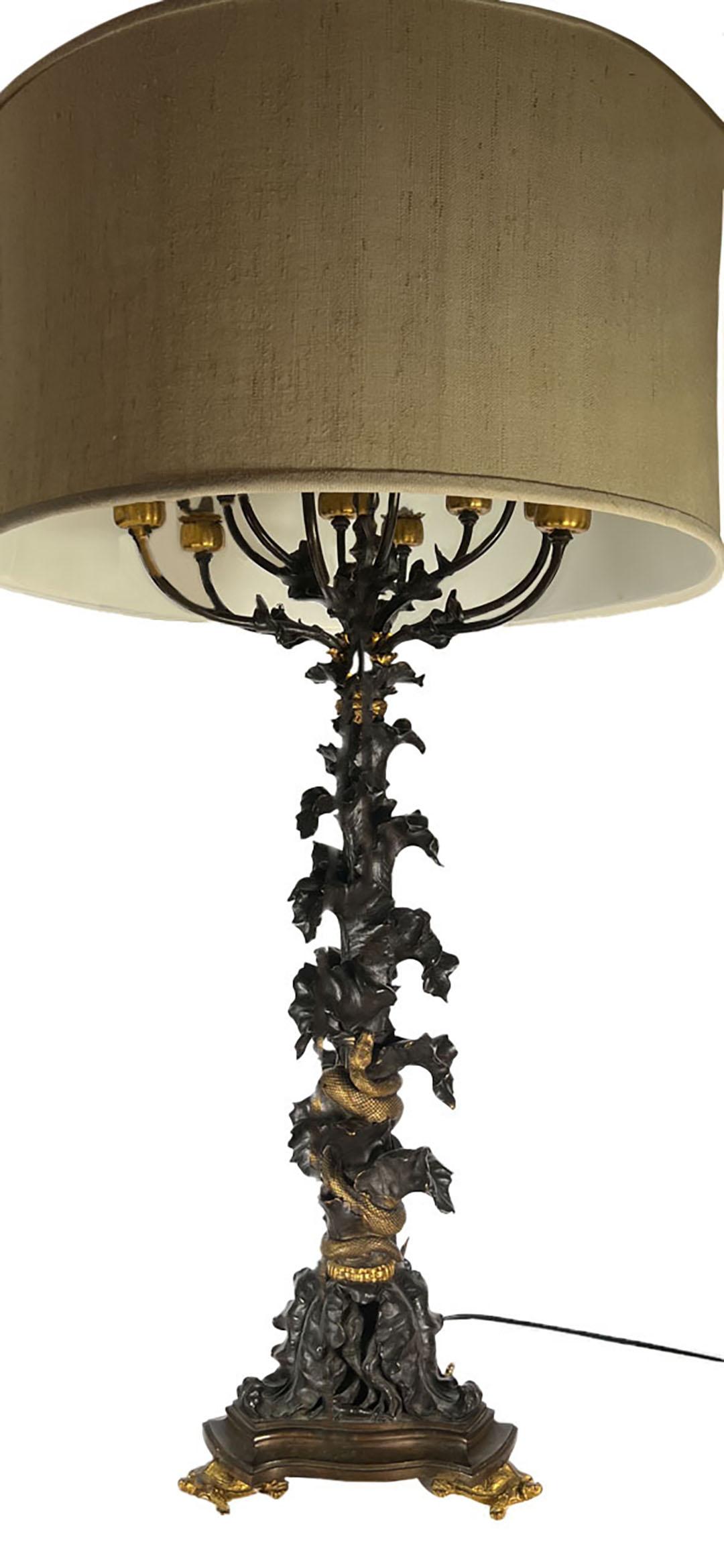 Pair of lamps attributed to EF Caldwell, New York City. Many of Caldwell designs and productions had turtles attached to the tripartite base. Gilded Eagle finials attached to the shades. Circa 1900.

The diameter of the lampshade is 21 1/2 inches.