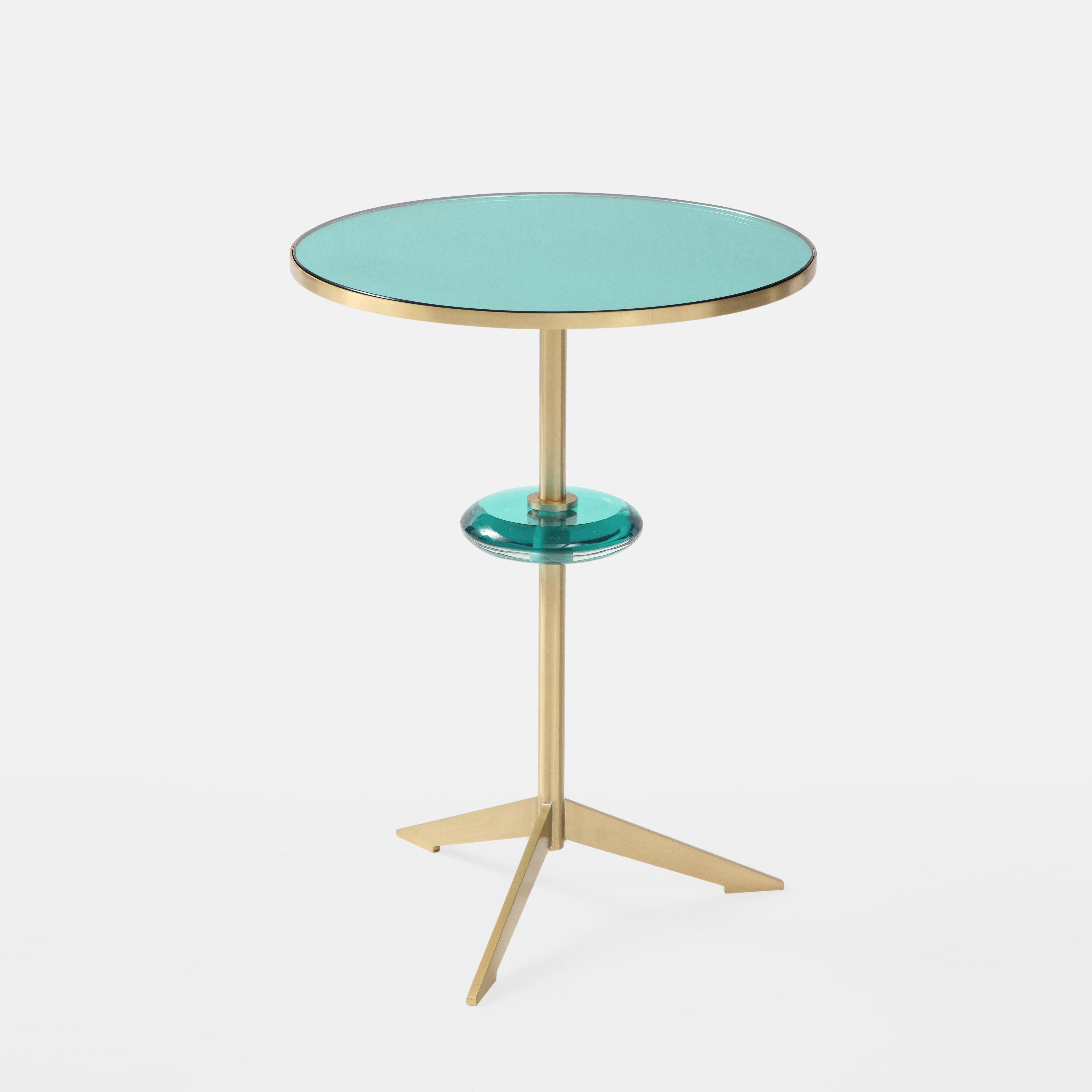 Effetto Vetro exquisite custom contemporary round side table with green glass mirrored top inset on satin brass tripod base with floating green glass orb suspended on brass stem. This exquisite modernist sculptural side table is handmade and the