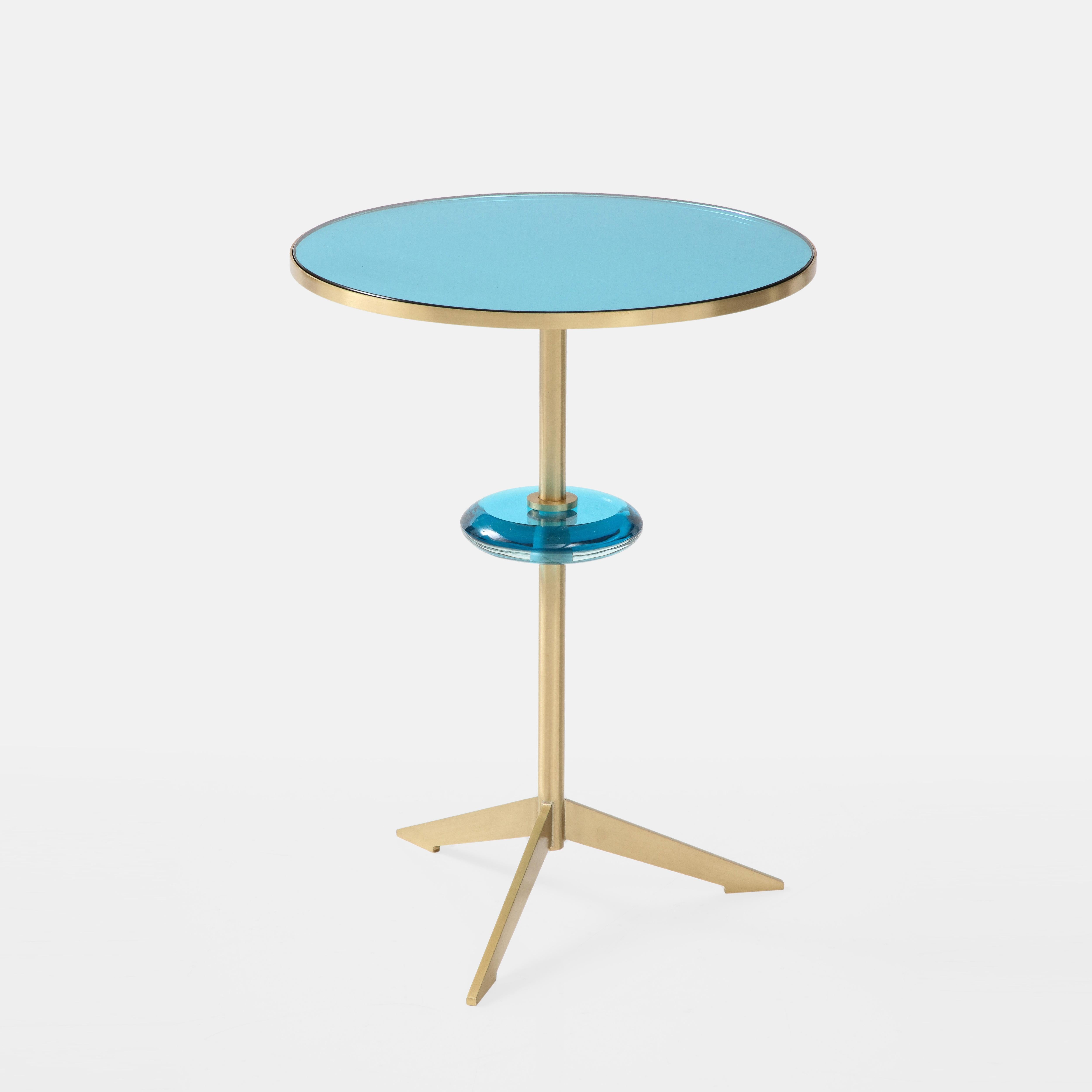 Effetto Vetro exquisite custom contemporary round side table with mirrored colored glass top inset on satin brass tripod base with floating colored glass orb suspended on brass stem. This lovely modernist sculptural side table (or pair) is currently