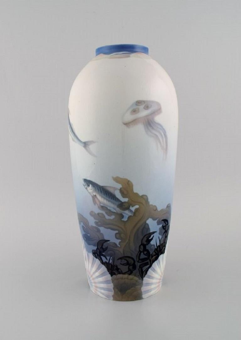 Effie Hegermann-Lindencrone for Bing & Grøndahl. 
Large Art Nouveau porcelain vase with hand-painted fish, crabs and jellyfish. 
Shells in relief. Early 20th century.
Measures: 35 x 16 cm.
In excellent condition.
Stamped.
2nd factory