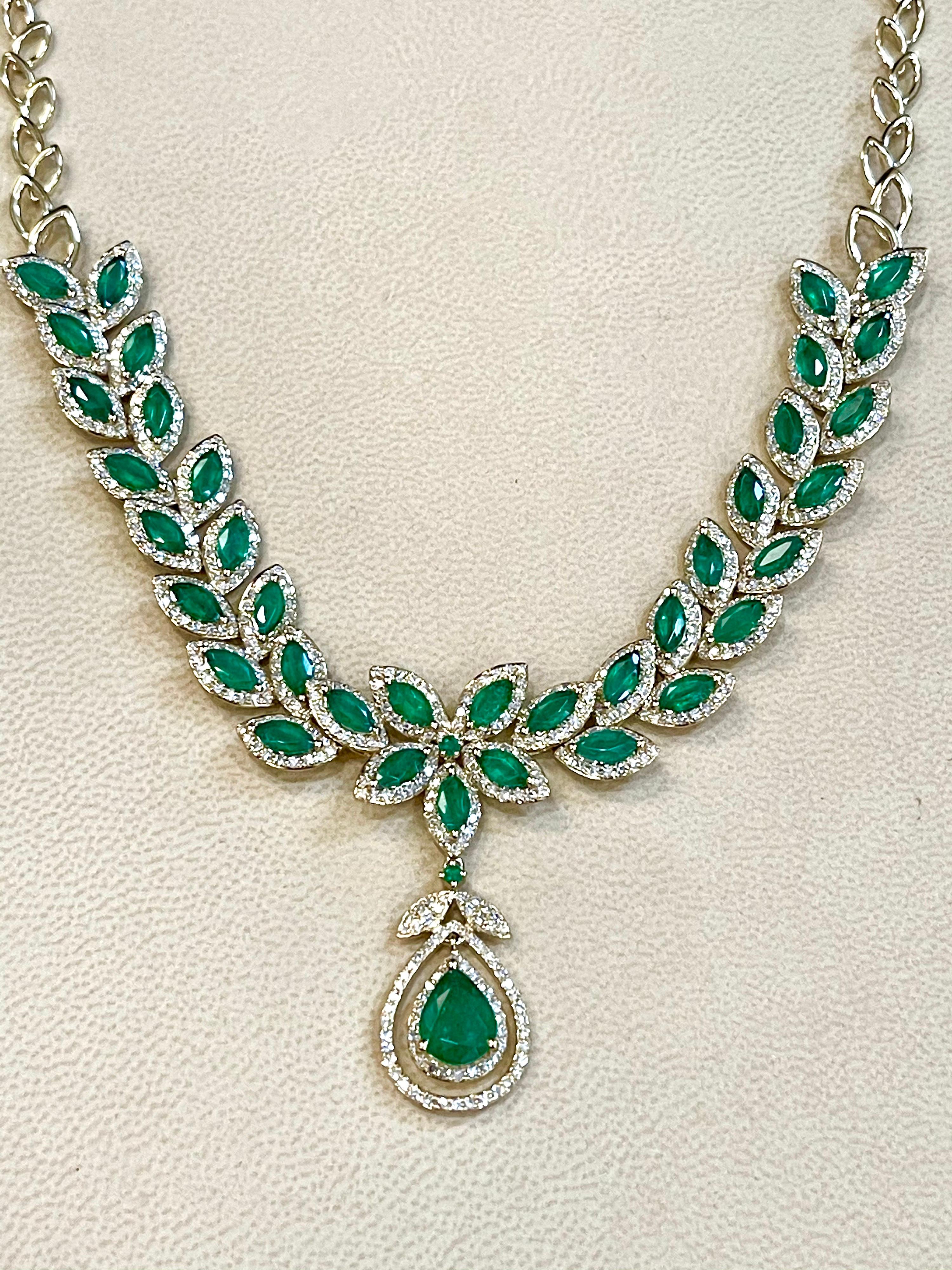 Designer Effy's 12 Carat Marquise Emerald &  2.76 Carat Diamond Necklace in 14 Karat Yellow Gold
This Simple yet elegant Necklace  consisting of a single pear shape emerald 9 X 7  mm dropping as a drop surrounded by two pear made of  brilliant cut