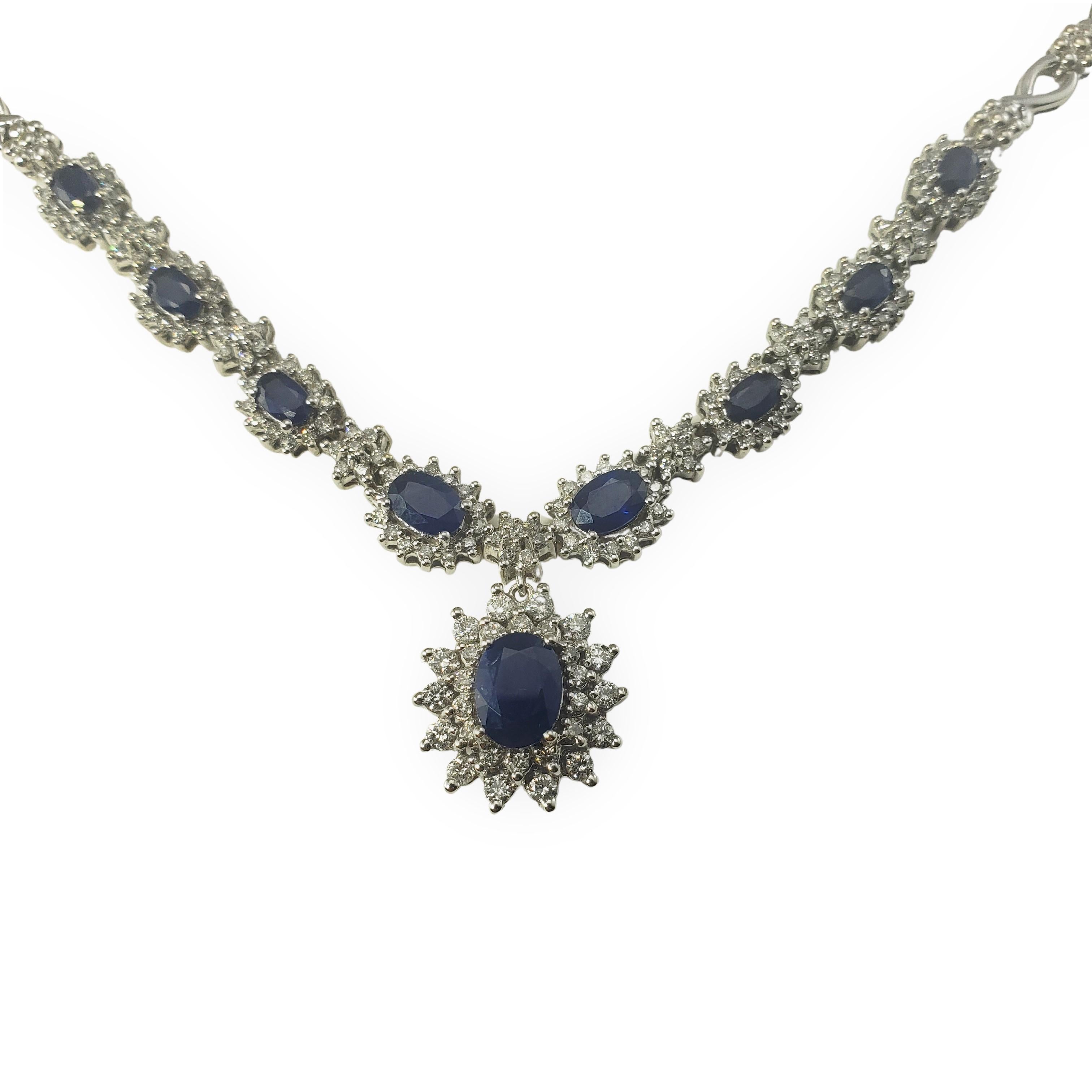 14 Karat White Gold Sapphire and Diamond Necklace-

This stunning necklace features nine oval sapphires and 176 round brilliant cut diamonds set in classic 14K white gold.  
Width: 4-8 mm.

Approximate sapphire total weight:  3.5 ct.

Approximate