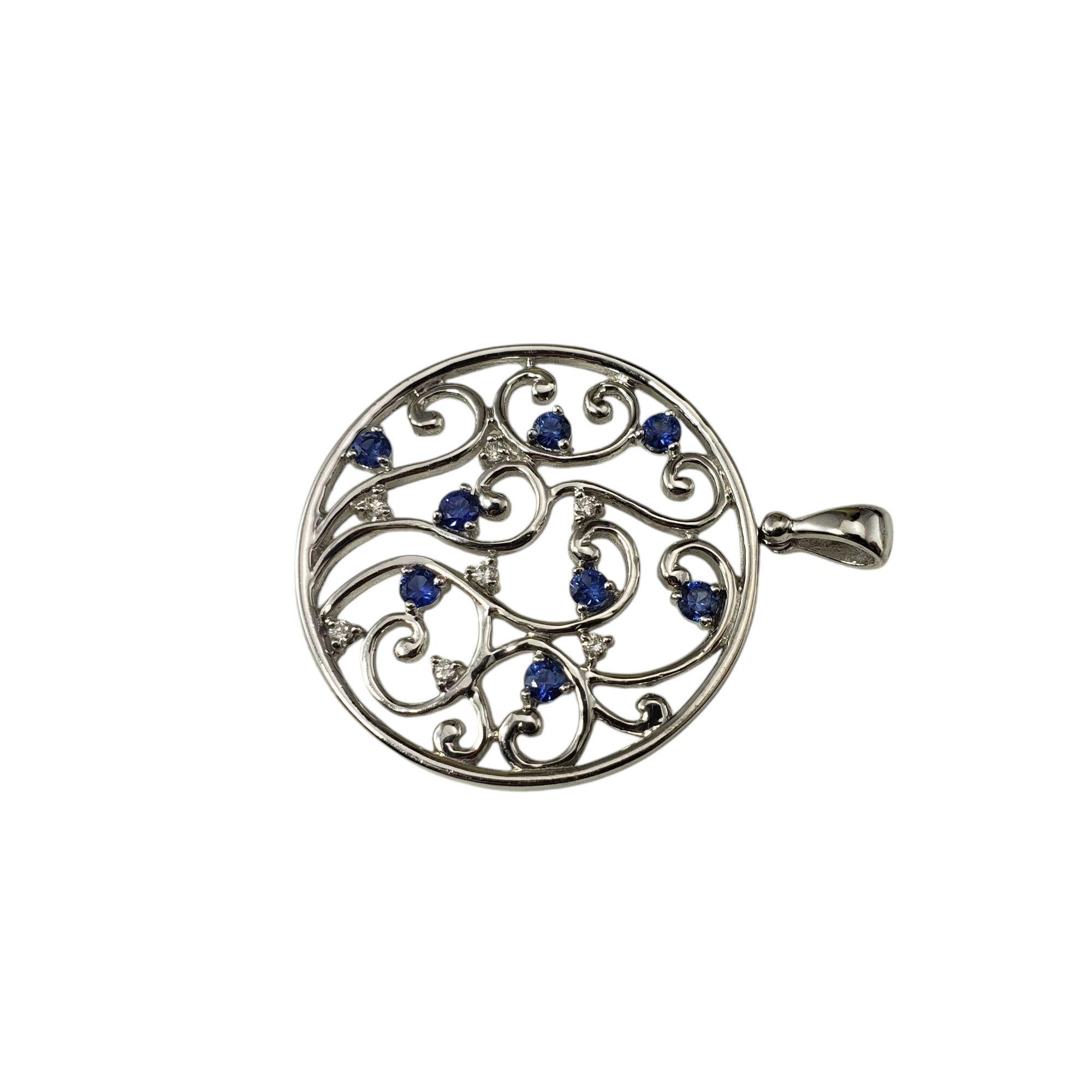 Effy 14 Karat White Gold Sapphire and Diamond Pendant-

This stunning pendant features seven round brilliant cut diamonds and eight blue sapphires set in beautifully detailed 14K white gold.

Approximate total diamond weight: .06 ct.

Diamond color: