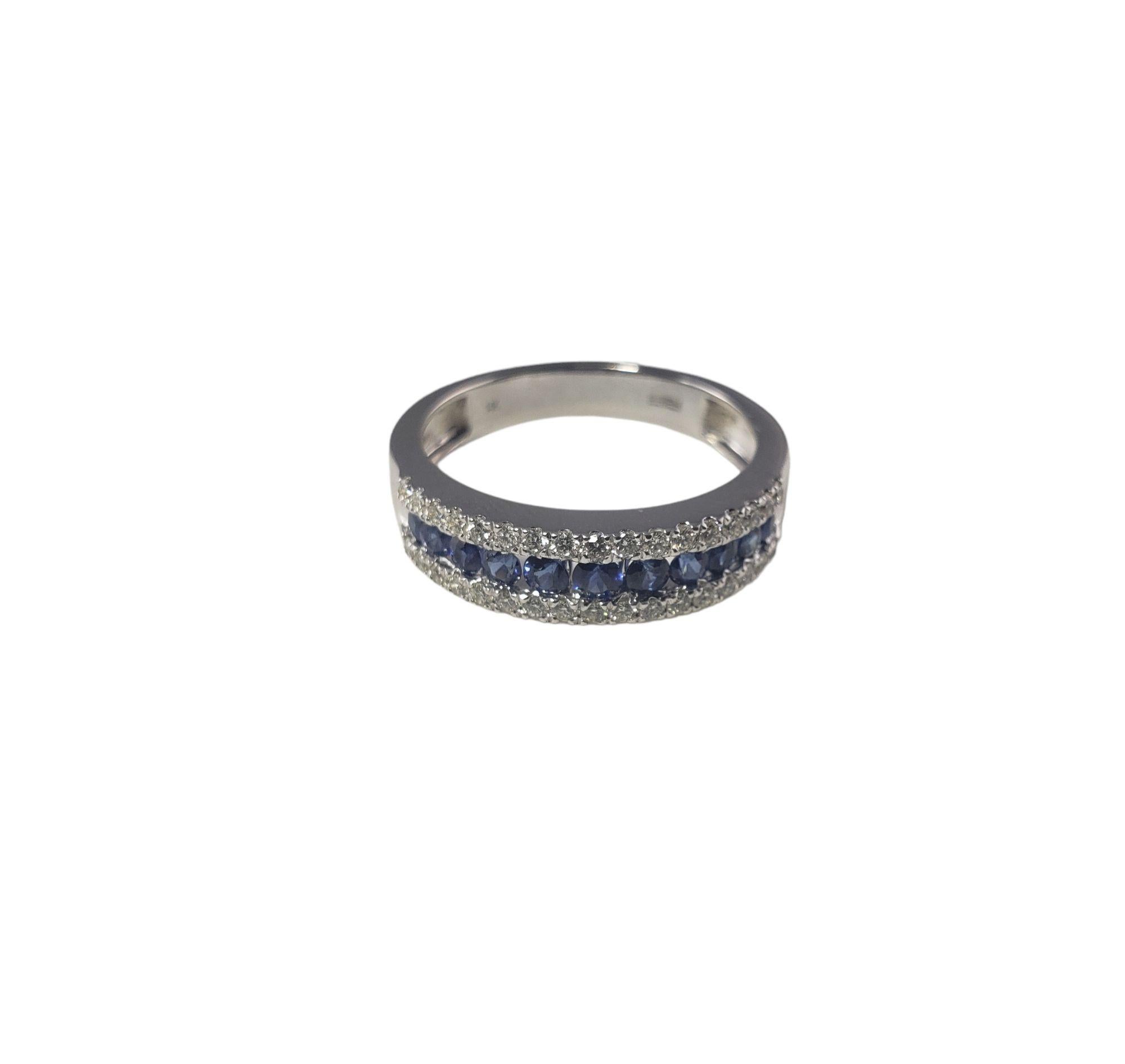 This sparkling ring features 11 round sapphires and 34 round brilliant cut diamonds set in 14K white gold.

Width:  5 mm.  Shank: 3 mm.

Approximate total diamond weight: .40 ct.

Diamond color: G

Diamond clarity: VS1

Ring Size: 8

Weight: 2.8