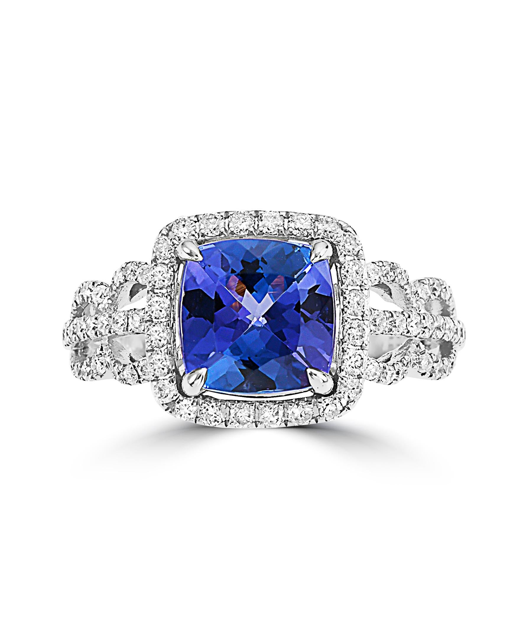This Effy design ring is set in 14K white gold. The design is set off with a cushion cut Tanzanite, with a total weight of 2.28ct.
The diamond accent stones are round in shape and the total weight is 0.59ct.
This ring is a sizable 7. 
The item