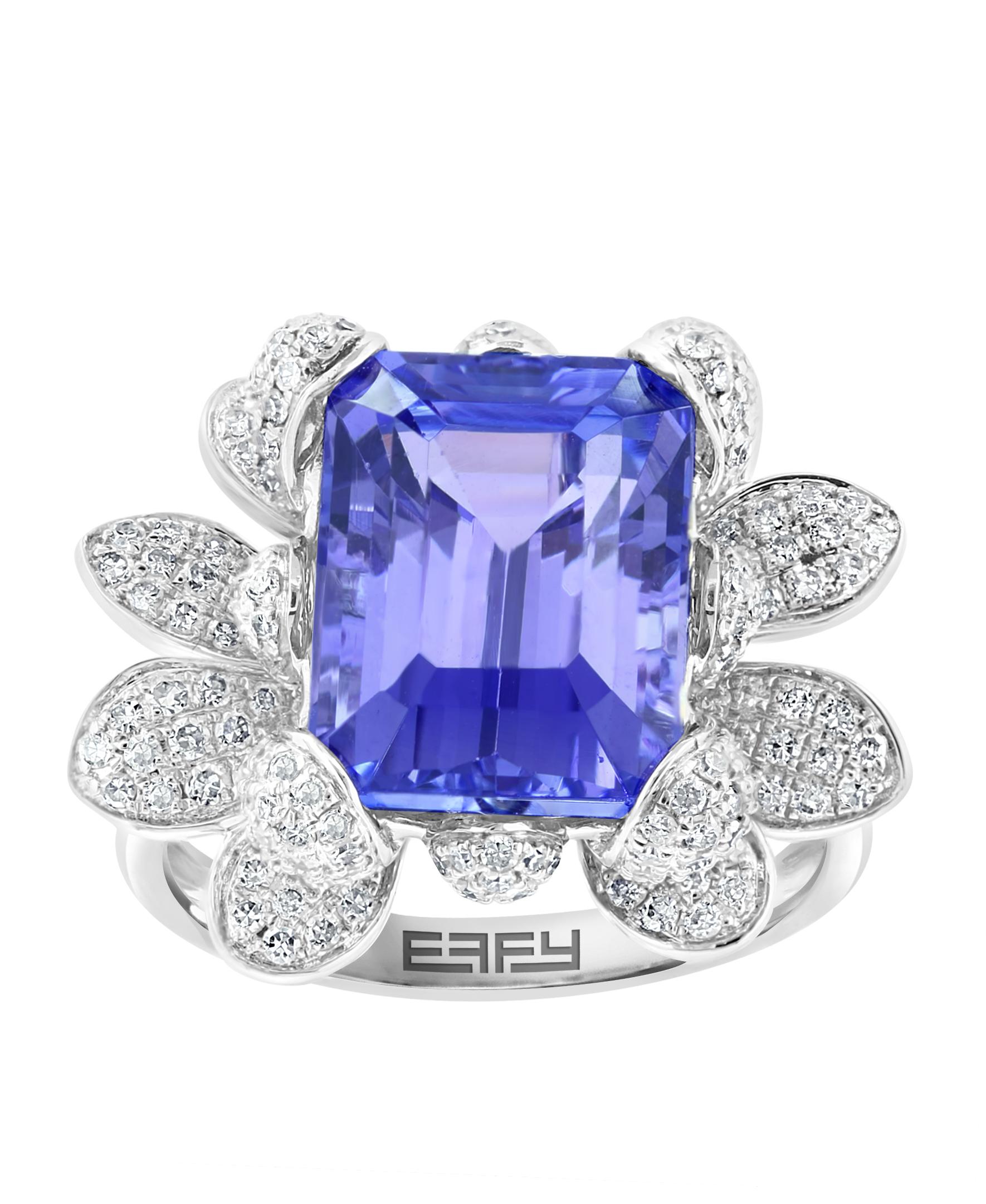 This Effy design ring is set in 14K white gold. The design is set off with an Emerald cut Tanzanite, with a total weight of 5.61ct.
The diamond accent stones are round in shape and the total weight is 1.19ct.
This ring is a sizable 7. 
The item