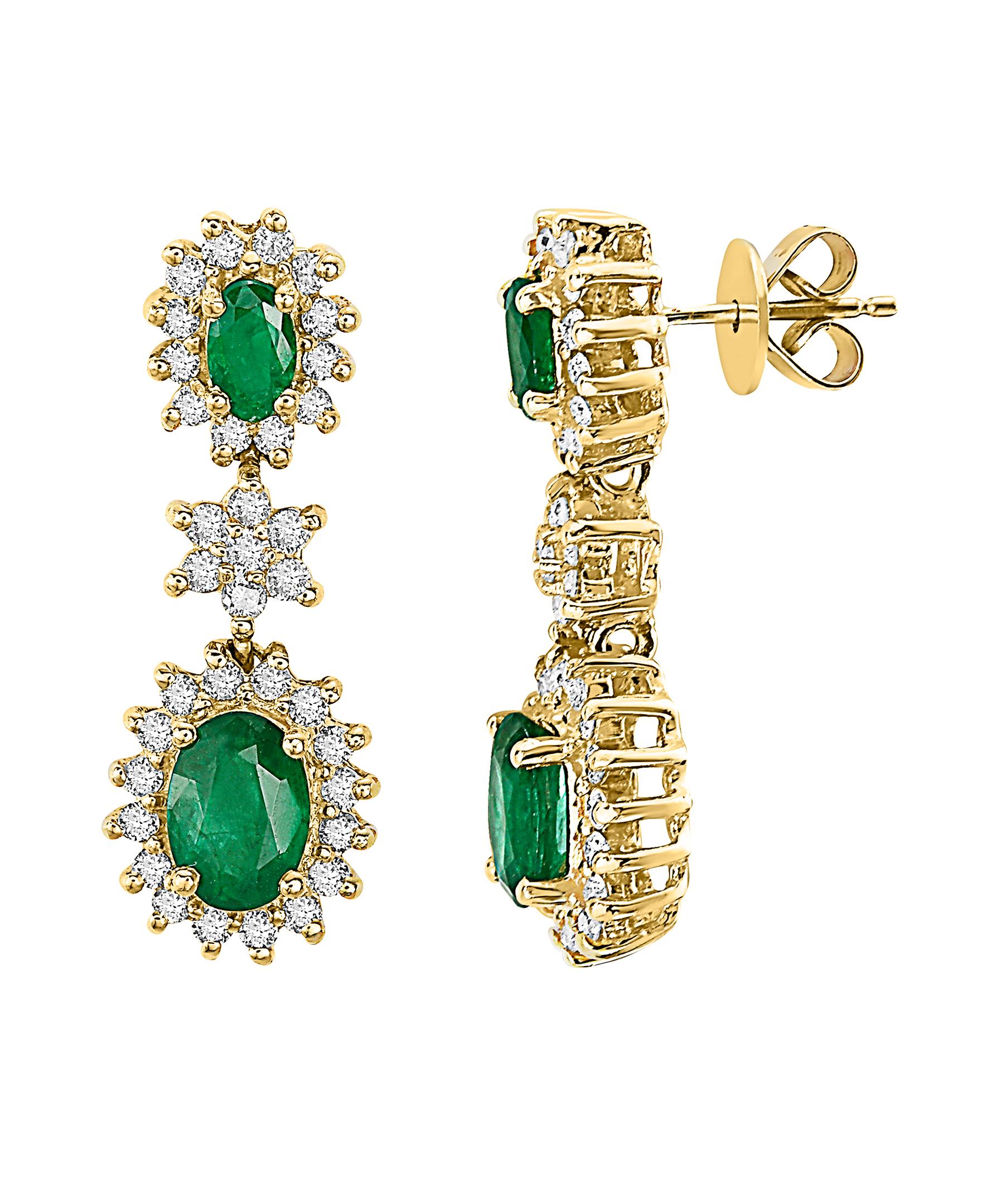 These Effy design earrings are set in 14K Yellow gold. The center stones are two pairs of Oval shape Emeralds, and their total weight is 2.00 ct.
The design is accented by round shape diamonds, with a total weight of 0.90 ct.

The item number is