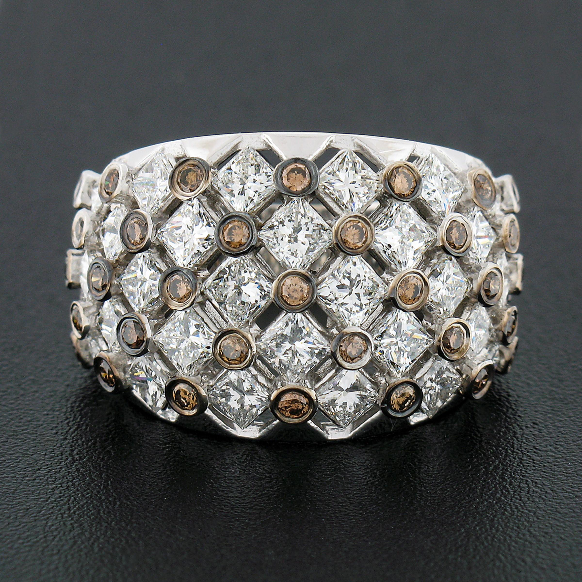 He we have an absolutely magnificent and fancy band ring that was crafted in solid 14k white gold and designed by Effy, featuring a wide and slightly domed top that is completely drenched with fine quality diamonds throughout. Its open top displays