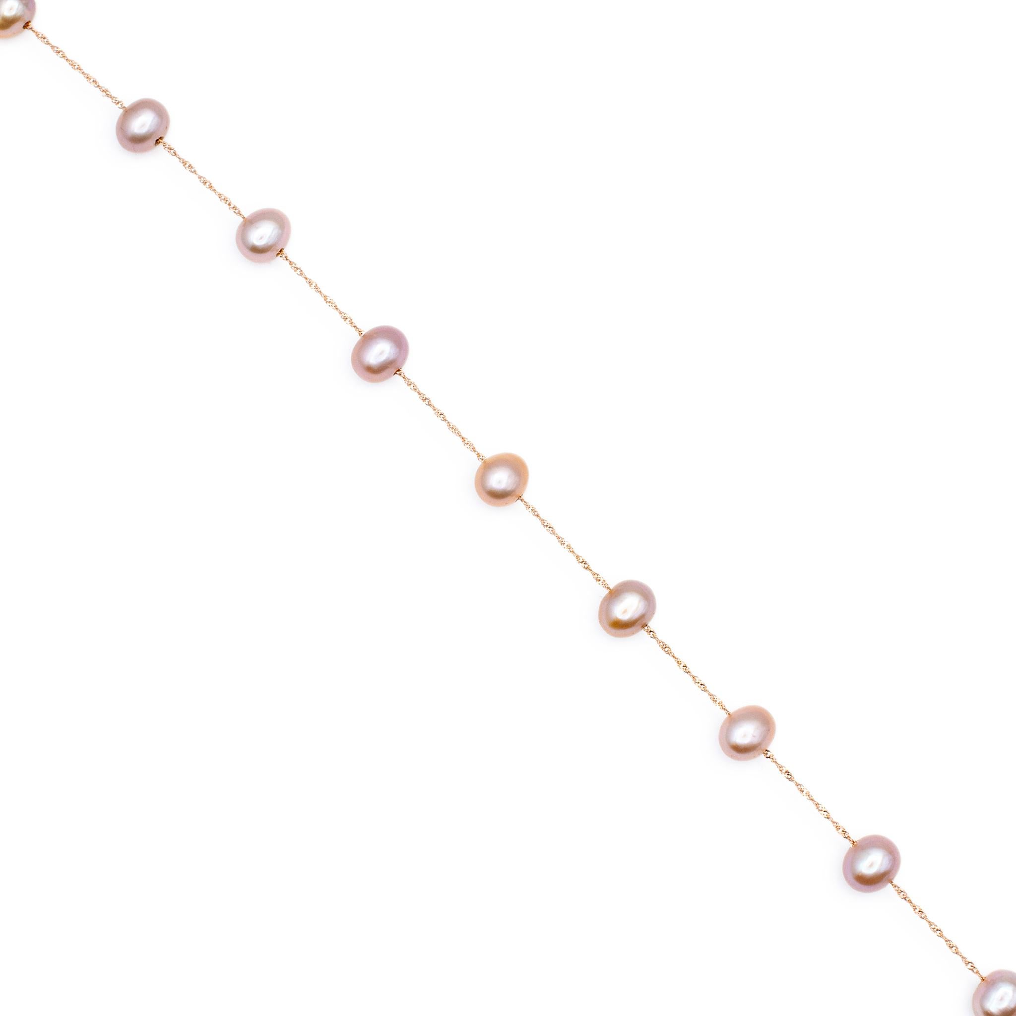 Brand: Effy

Gender: Ladies

Metal Type: 14K Rose Gold

Length: 18.00 inches

Weight: 7.11 grams.

Lady's designer made 14K rose gold single strand, pearl station necklace. Engraved with 