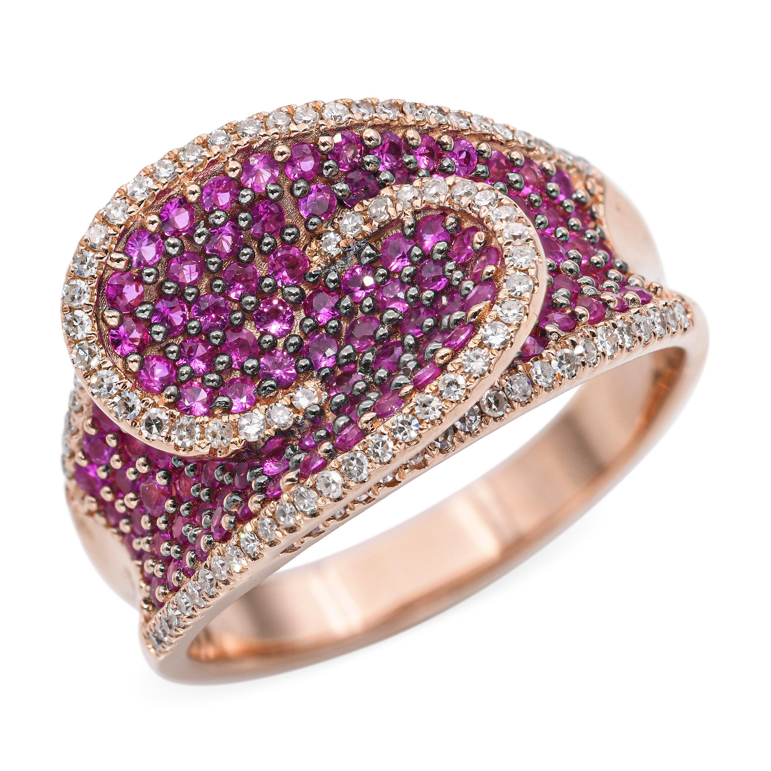 This exquisite ring features a stunning array of vibrant rubies, meticulously set in a swirling pattern. The sapphires are complemented by a border of sparkling round brilliant-cut diamonds, enhancing the ring's luxurious appeal. Crafted in rose