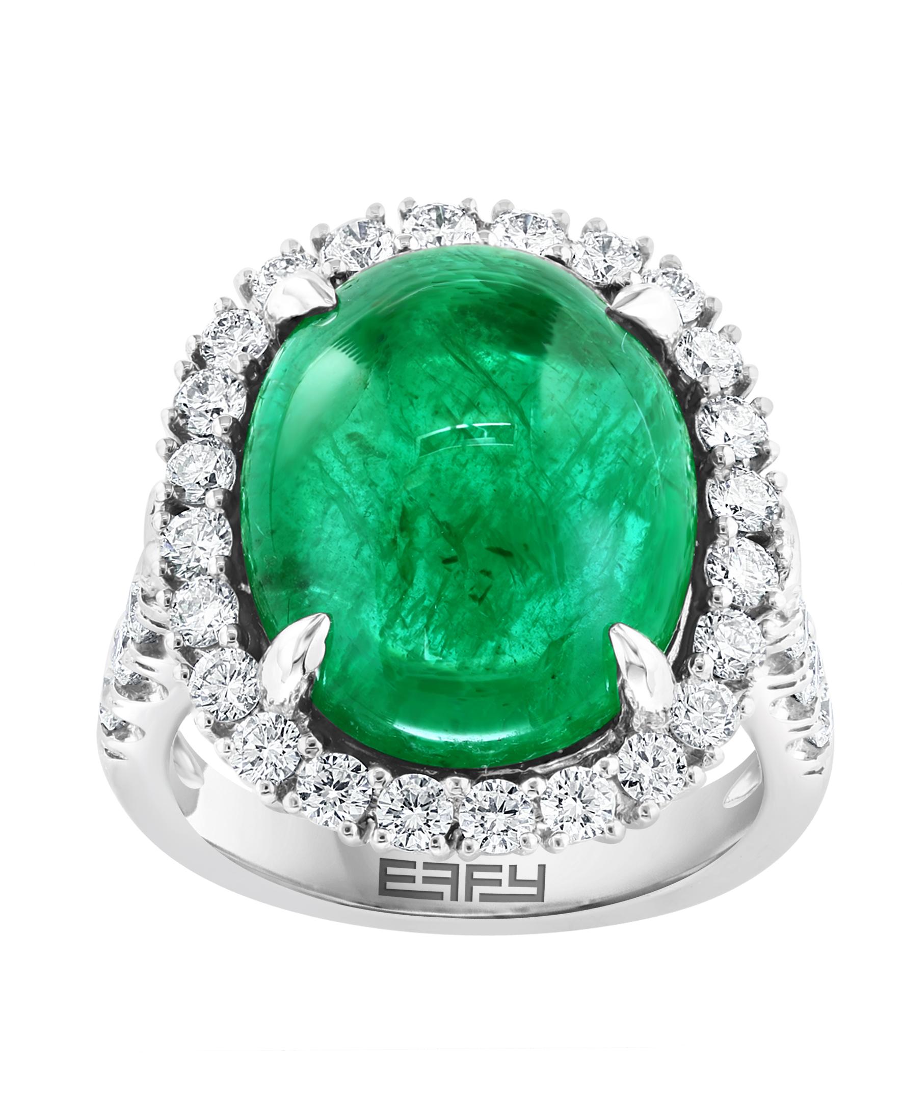 This Effy Hematian Collection design ring is set in 18K White gold. The center stone is Cabochon shape Emerald with a total weight of 11.47ct.
The center stone is surrounded by 32 round shape accent diamonds, with a total weight is 1.32 ct.
This