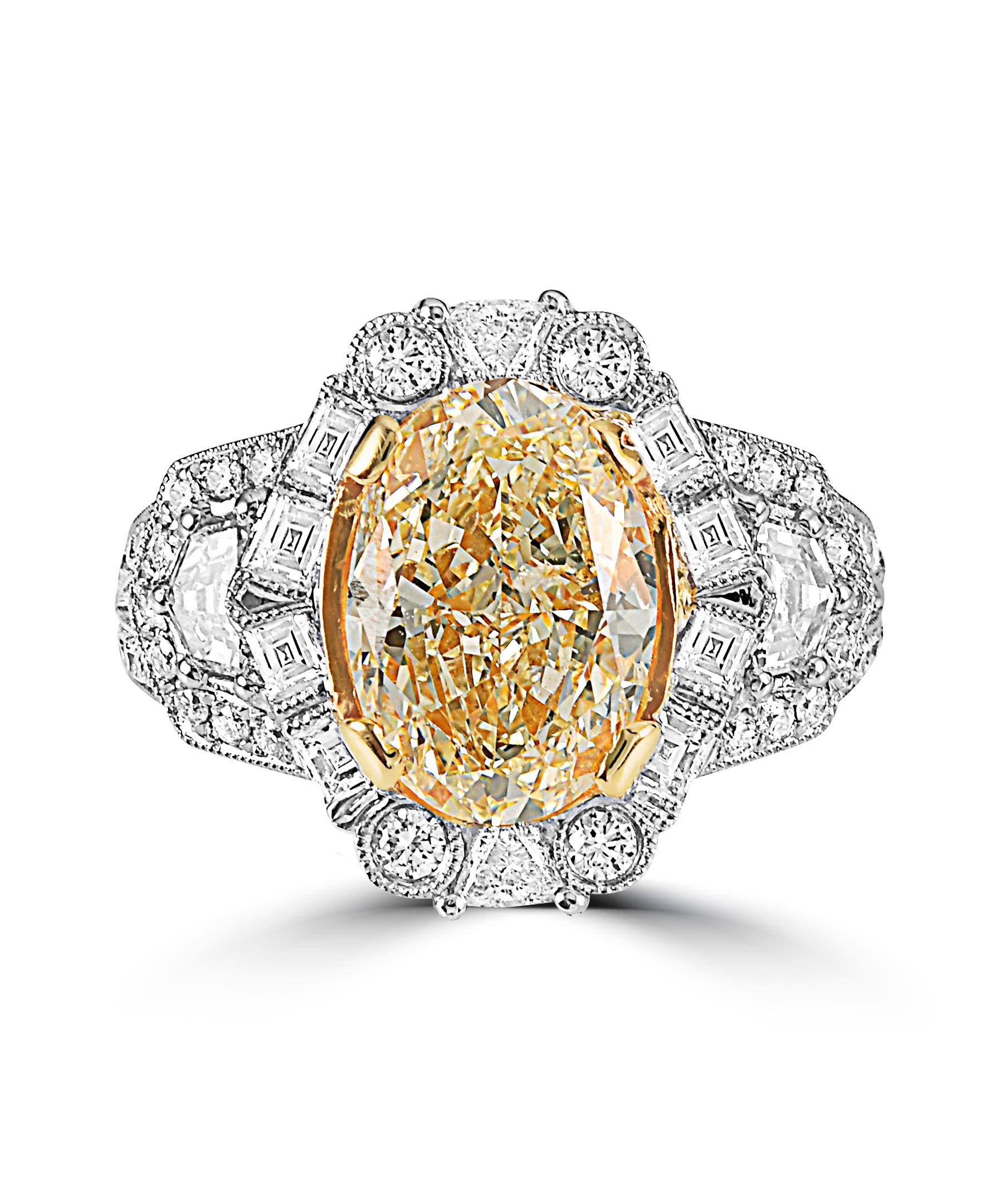 This Effy Hematian Collection ring is set in 18K White & Yellow gold. The design is set off with stunning Natural Yellow Diamond with a total weight of 4.02ct.
The diamond accent stones are a unique combination of round, square, triangle and half