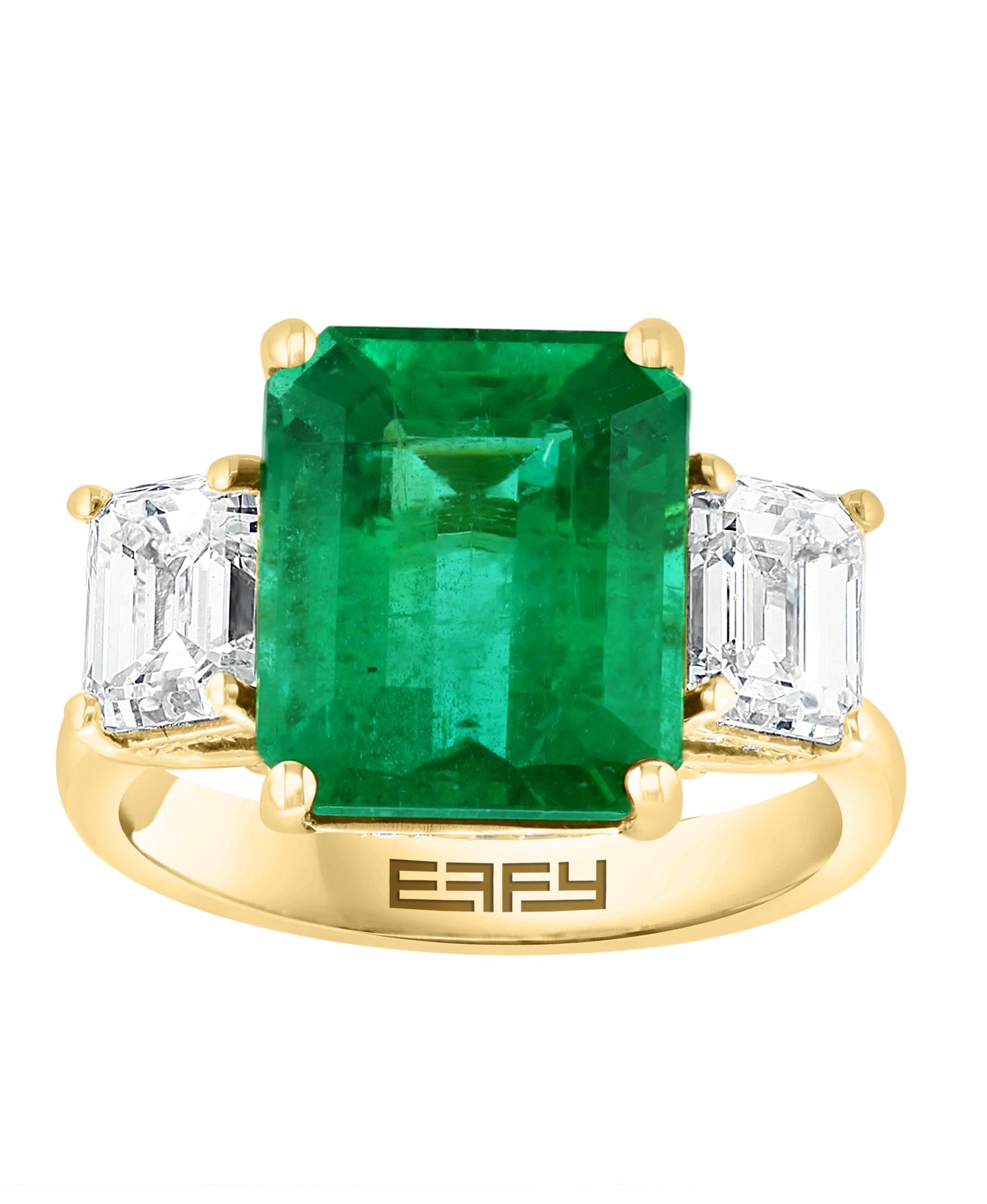 This Effy Hematian Collection design ring is set in 18K Yellow gold. The center stone is an Emerald Cut Emerald with a total weight of 5.43ct.
The center stone is surrounded by 2 Emerald Cut diamonds and 32 round shape accent diamonds, with a total