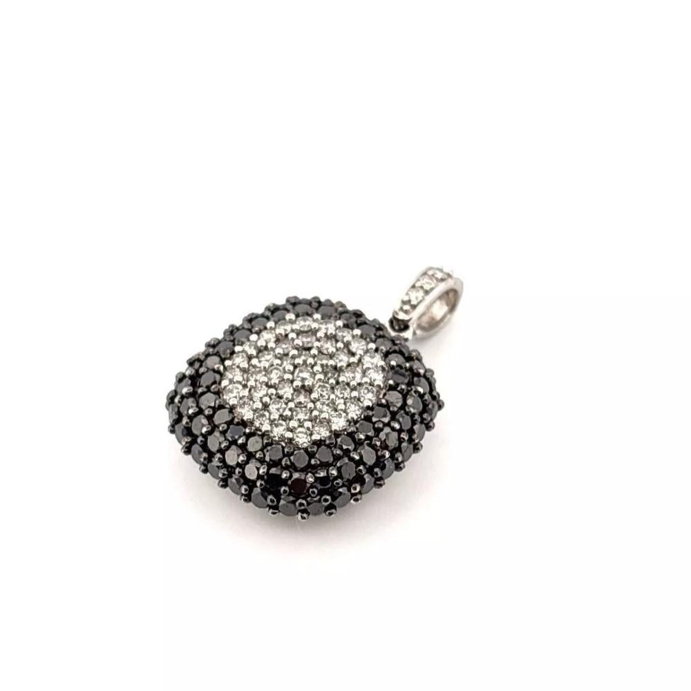 Offered is an authentic Effy cushion-shaped pendant crafted in solid 14K white gold, featuring a stunning contrast of black and white round brilliant-cut diamonds in pavé settings. This bold design features a center dome of sparkling white diamonds,