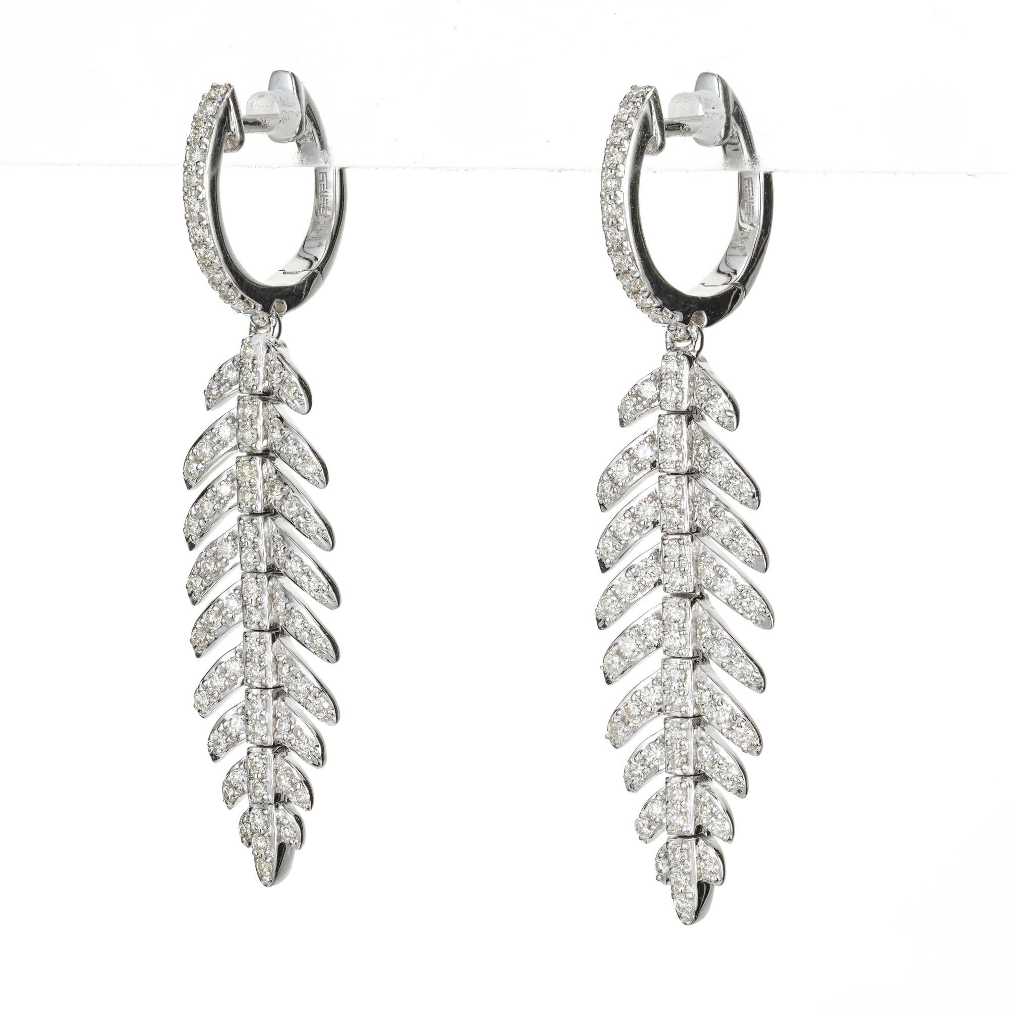 Effy flexible feather diamond earrings. Feather shaped 14k white gold dangle drop earrings with 148 round cut diamonds. 

148 round diamonds, G-K SI-I approx. .89cts
14k white gold 
Stamped: 14k
6.3 grams
Top to bottom: 40.6mm or 1.6 Inches
Width: