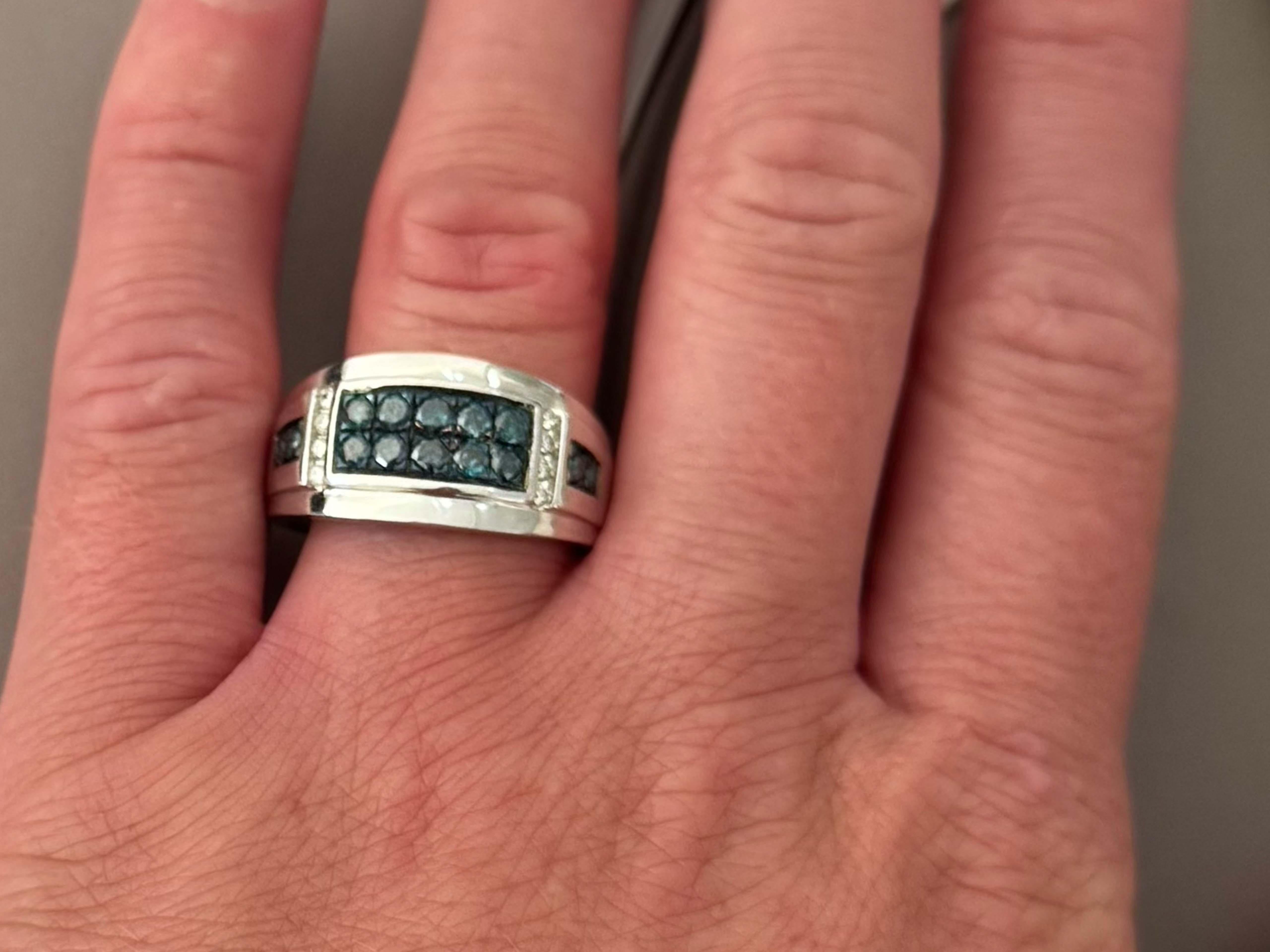 Item Specifications:

Designer: EFFY 

Metal: 14k White Gold

Ring Weight: 8.4 grams

Ring Size: 10

Ring Height: 11.7 mm

Diamond Specifications:

Diamond Count: 14 blue diamonds and 8 white diamonds

White Diamond Color: G

White Diamond Clarity: