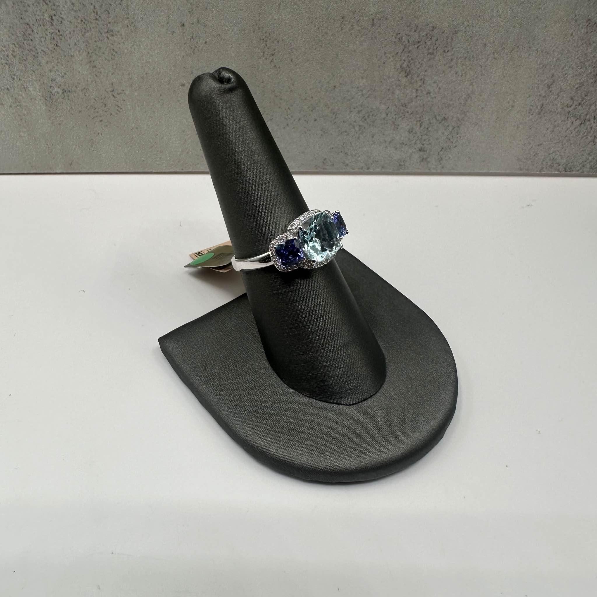 This stunning Designer Effy Blue Multicolor Ring in 14kt white gold features 3.20ctw of cushion cut aquamarine and tanzanite, complemented by 0.15ctw of natural GH SI round single-cut diamonds for added sparkle. Sized at 7, it fits most average