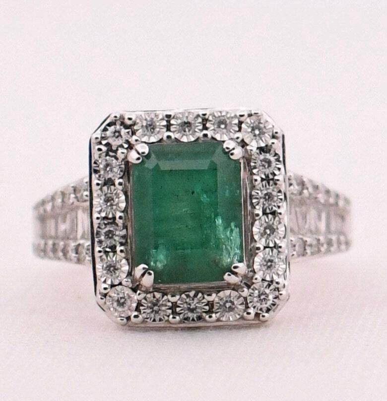 Prepare to be captivated by the striking beauty of this remarkable creation from EFFY. Meticulously crafted in 14K white gold, this exquisite cocktail ring demands attention from every angle. The shanks are adorned with a mesmerizing array of
