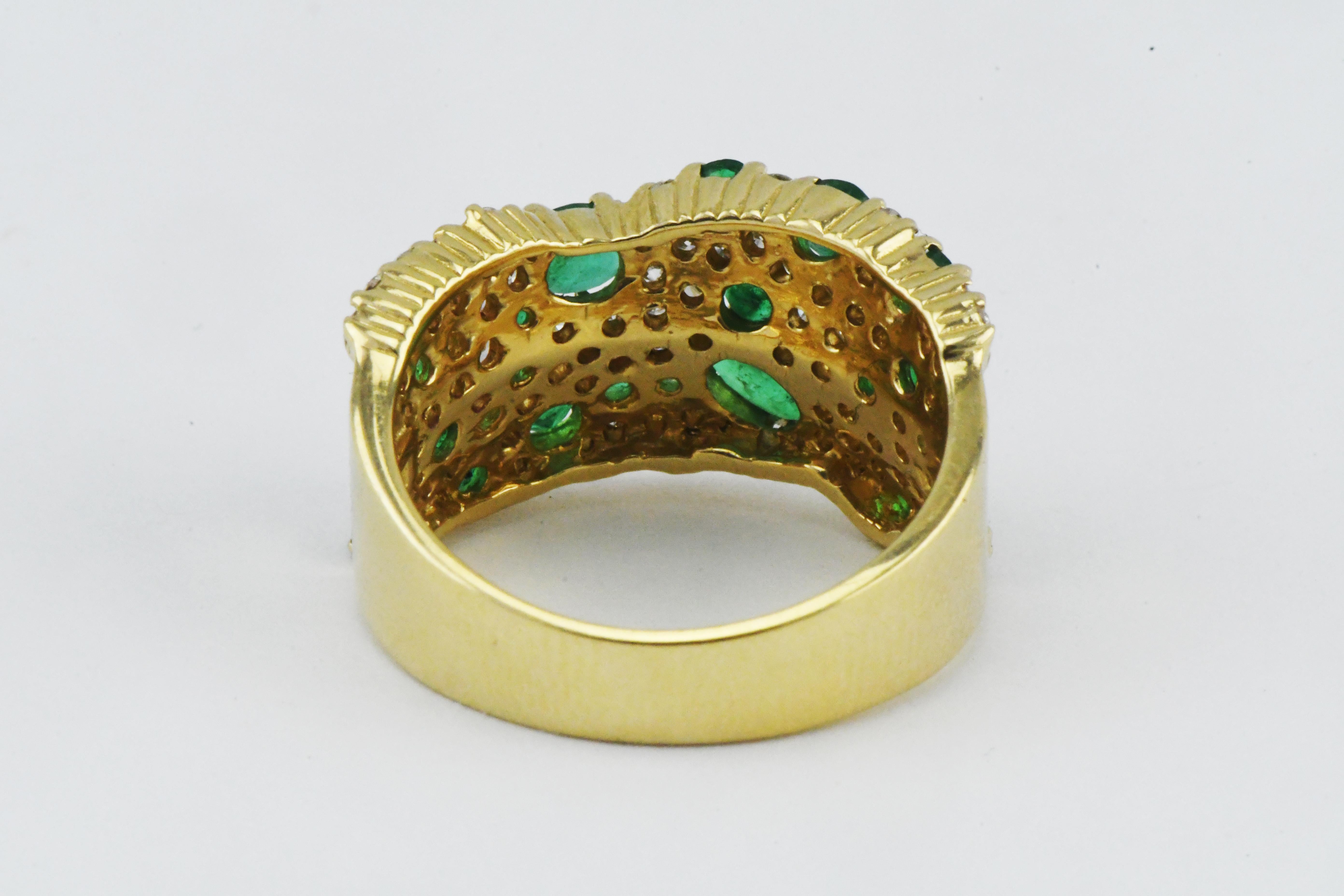 Vintage Signed 14k Gold Cluster Ring with 1.50ctw Natural Emeralds and Diamonds 1.15ctw.  Mad in the USA. Weight is  7.4 grams  Ring is Size 8 