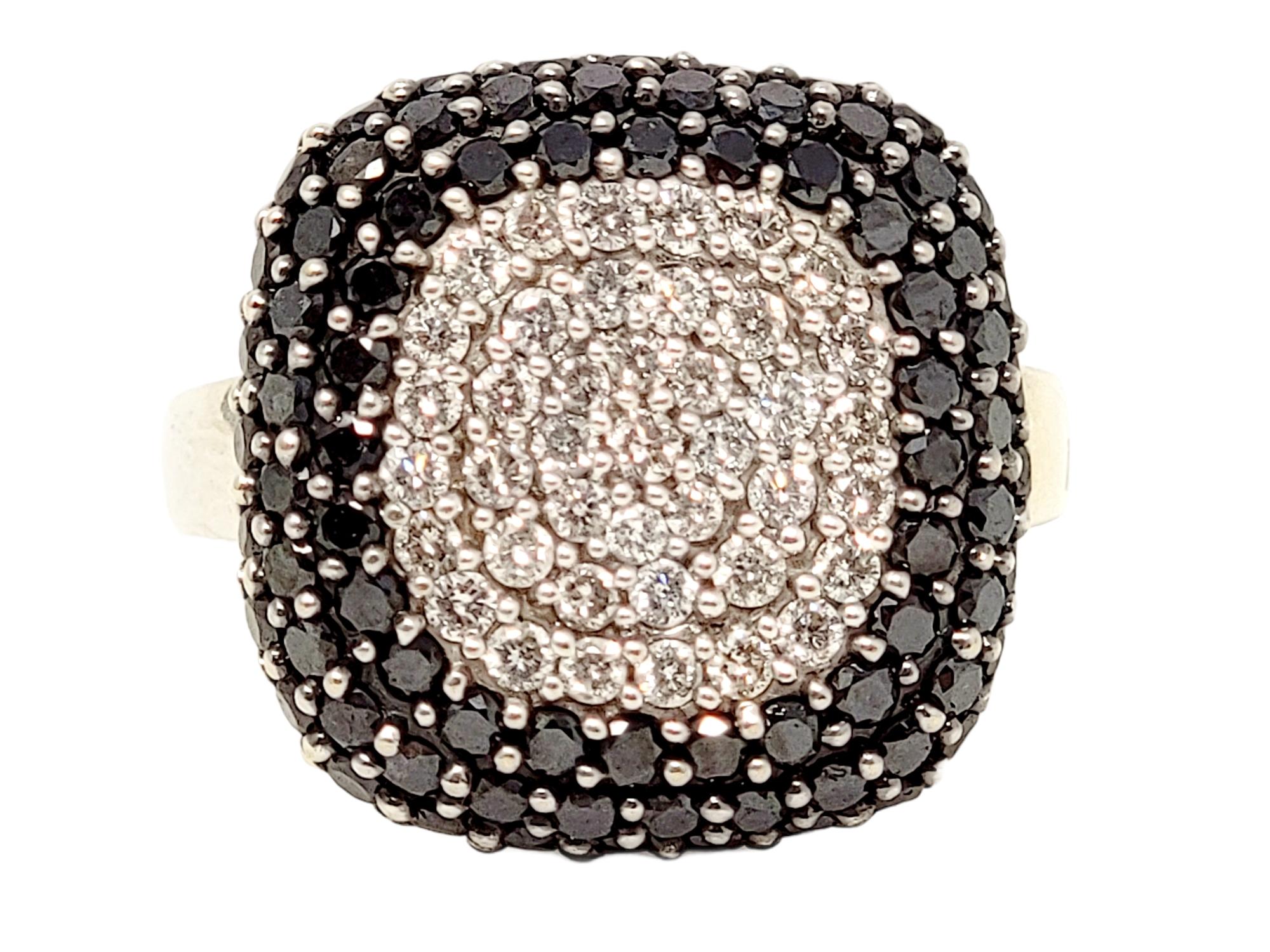 Ring size: 6.5

Brilliant black and white pave diamond cocktail ring by Effy fills the finger with modern glamour.

Ring size: 6.5
Weight: 8.00 grams
Metal: 14 Karat White Gold
Natural Diamonds: 2.02 ctw 
Diamond cut: Round Brilliant
Diamond color: