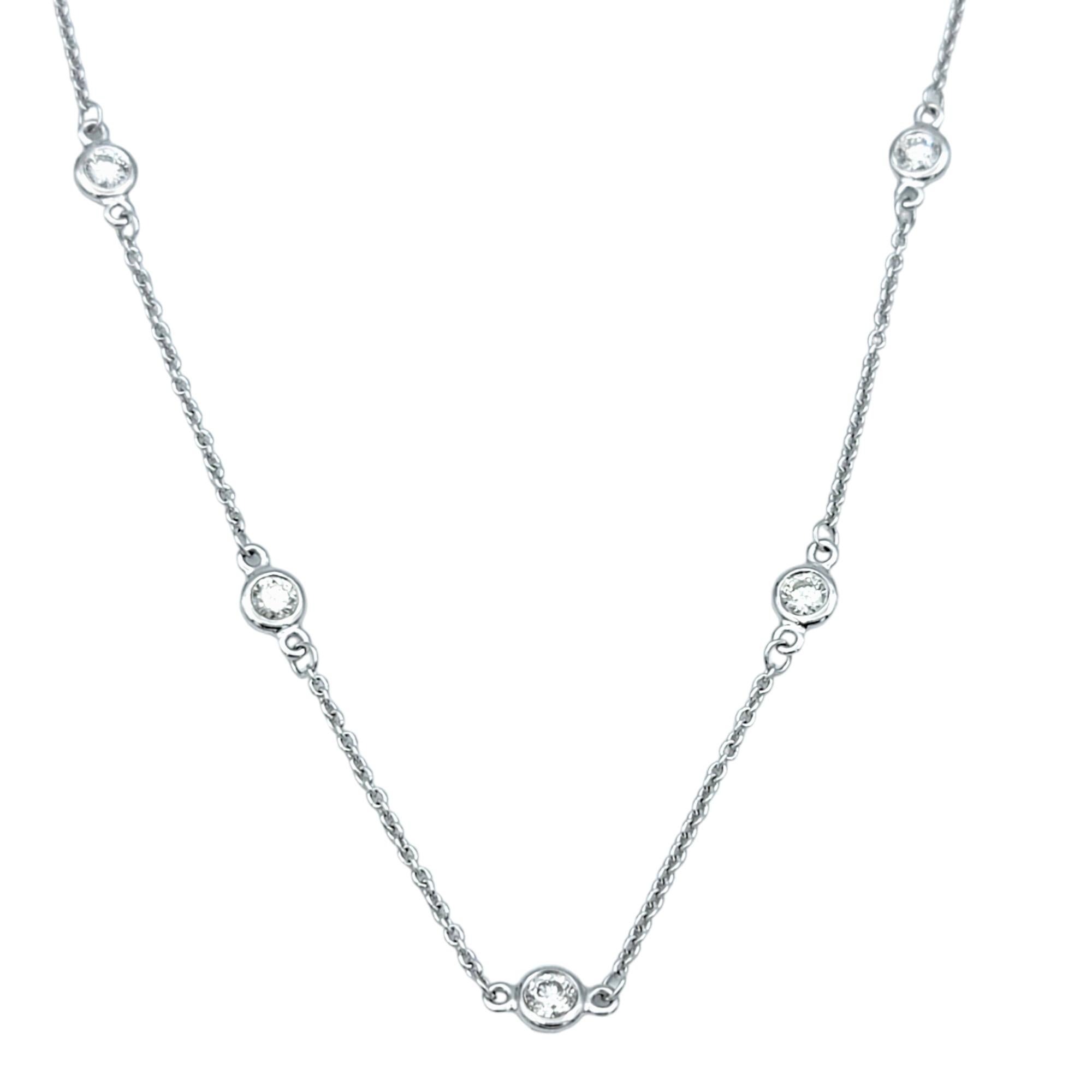 This stunning Effy diamond station necklace embodies elegance and versatility. Crafted in lustrous 14 karat white gold, this necklace features a delicate cable chain adorned with dazzling bezel-set diamonds.

Each diamond station on the chain adds a