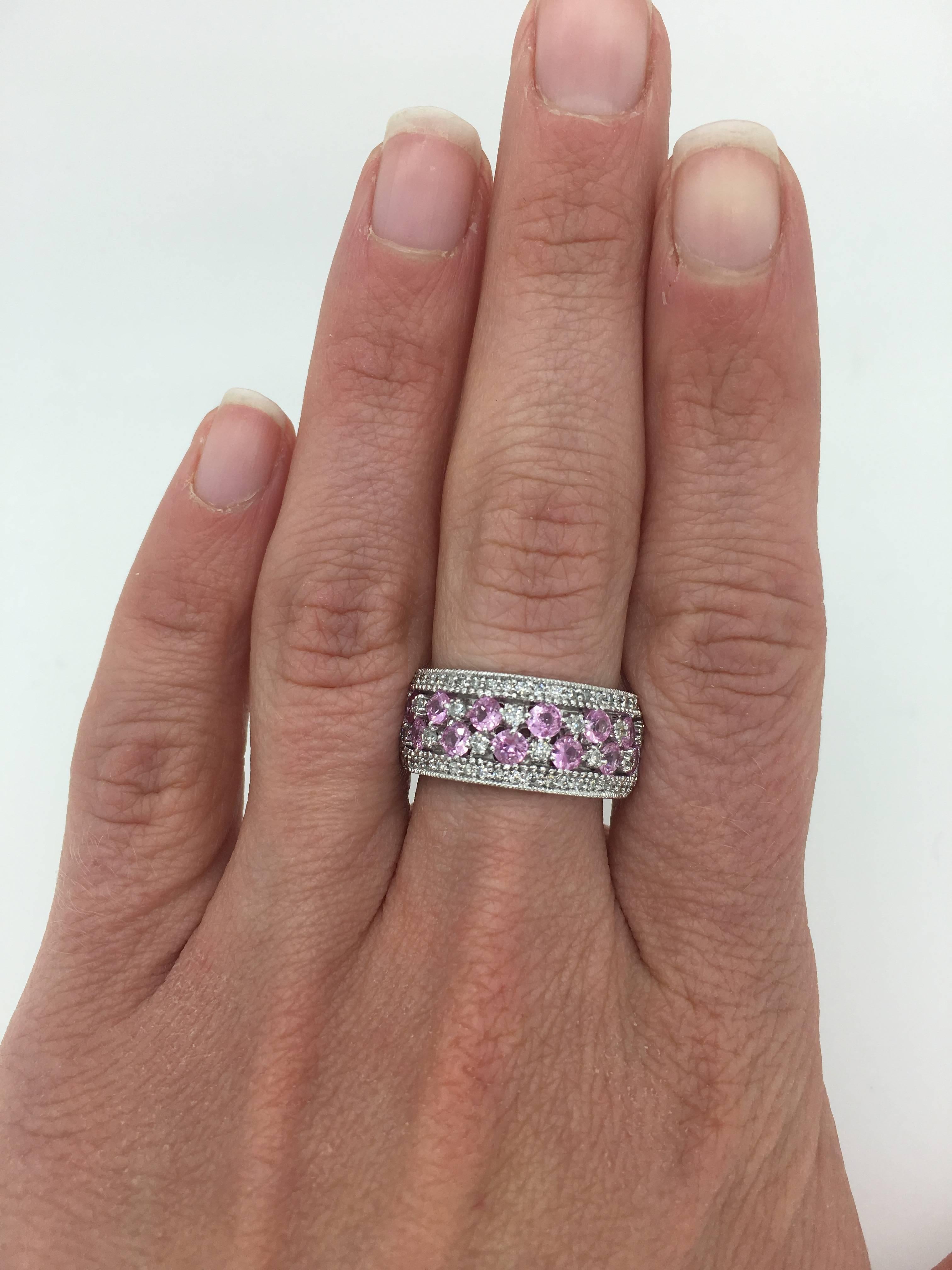 EFFY Diamond and pink sapphire band in 14K White Gold

Designer: EFFY
Gemstone: 12 Round Cut Pink Sapphire
Gemstone Size: Approximately 2.75mm
Diamond Carat Weight: Approximately .65CTW
Diamond Cut: 52 Round Brilliant 
Color: Average G-I
Clarity: