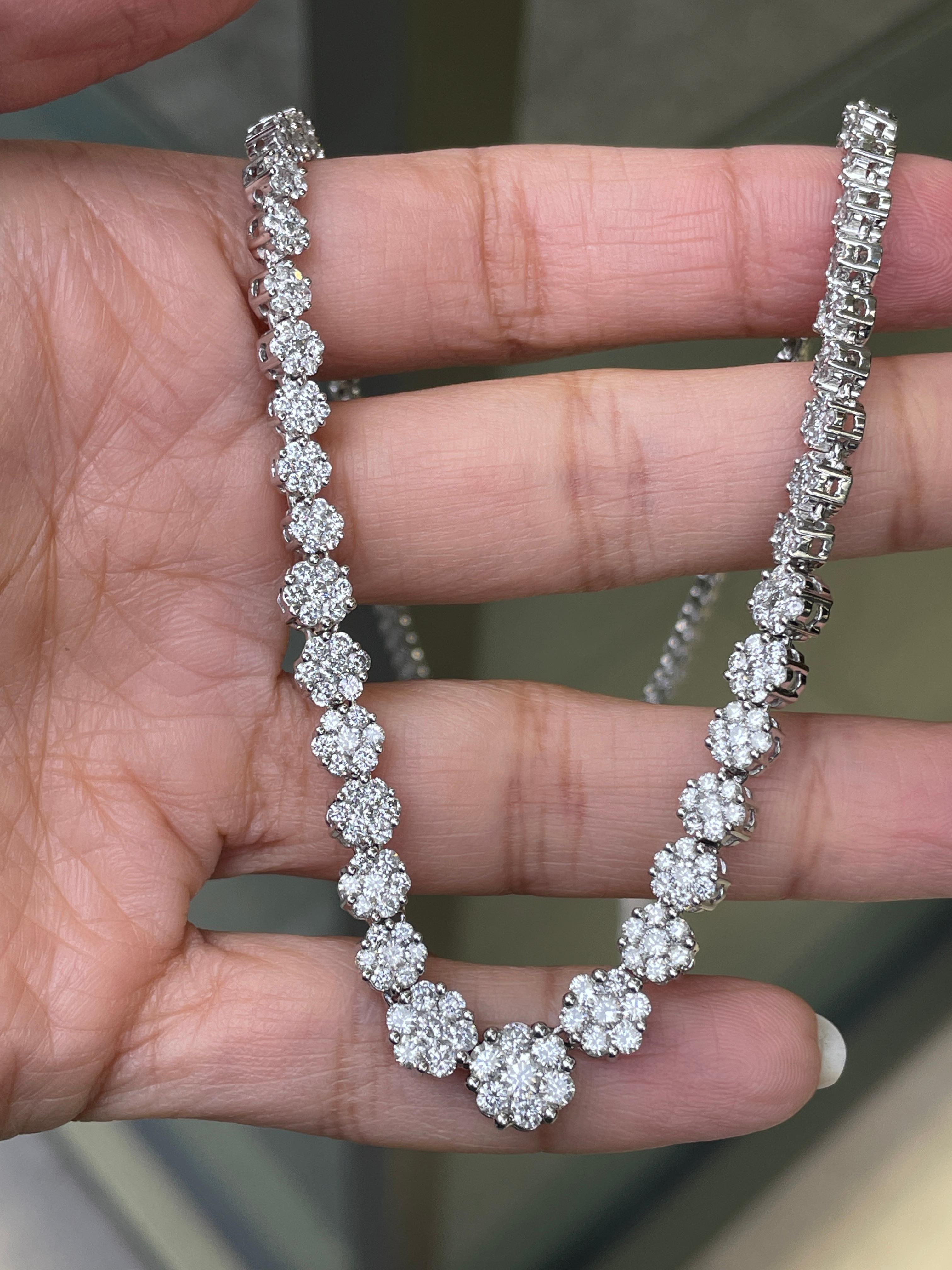 Experience the epitome of luxury with this captivating diamond necklace by famous jewellery designer, Effy Hematian.

A breathtaking articulated series of 35 delicate floral diamond clusters, with an impressive combined weight of approximately