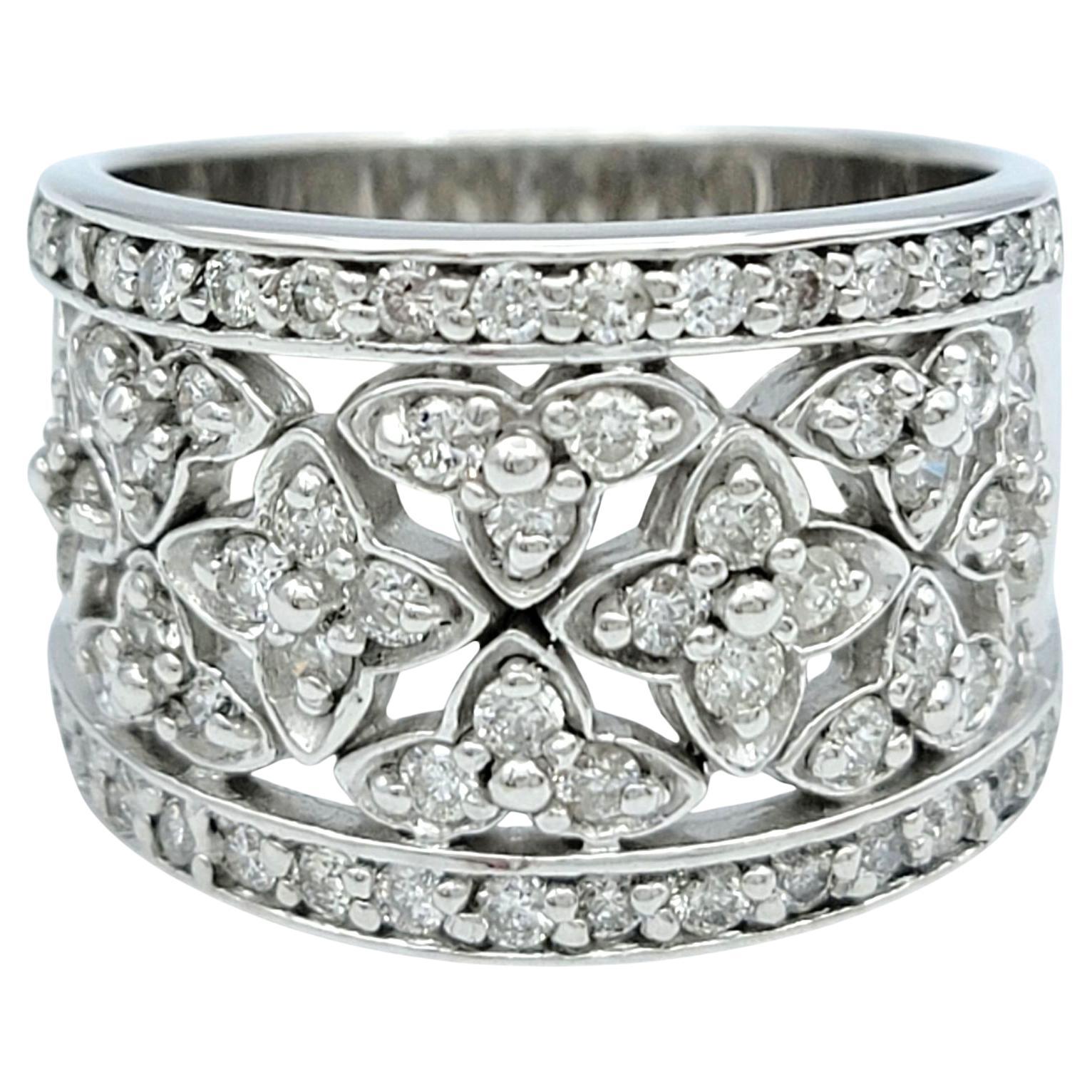 Ring Size: 7

This exquisitely crafted diamond ring by Effy features a delicate floral motif, beautifully set in 14 karat white gold. The intricate design is adorned with sparkling diamonds that form petal-like shapes, creating an elegant aesthetic.