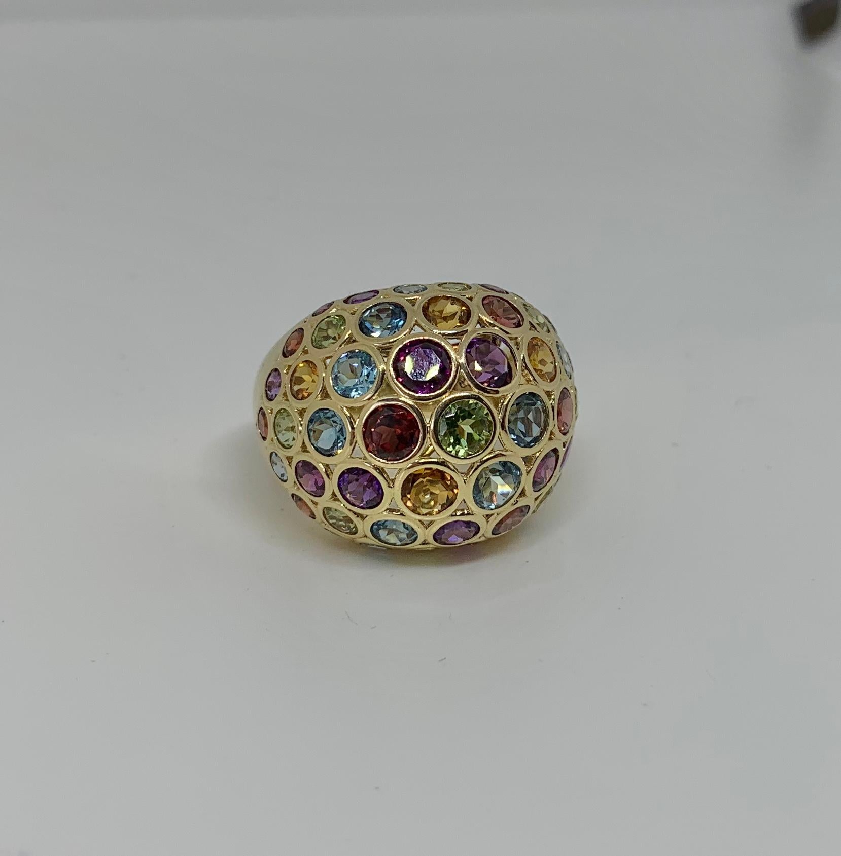 This is a gorgeous Retro Mid-Century Modern Cocktail Ring with Peridot, Aquamarine, Amethyst, Citrine, Garnet and Topaz gems by EFFY.  The fabulous round faceted jewels create a vibrant rainbow of color and are wonderfully cut to show off their