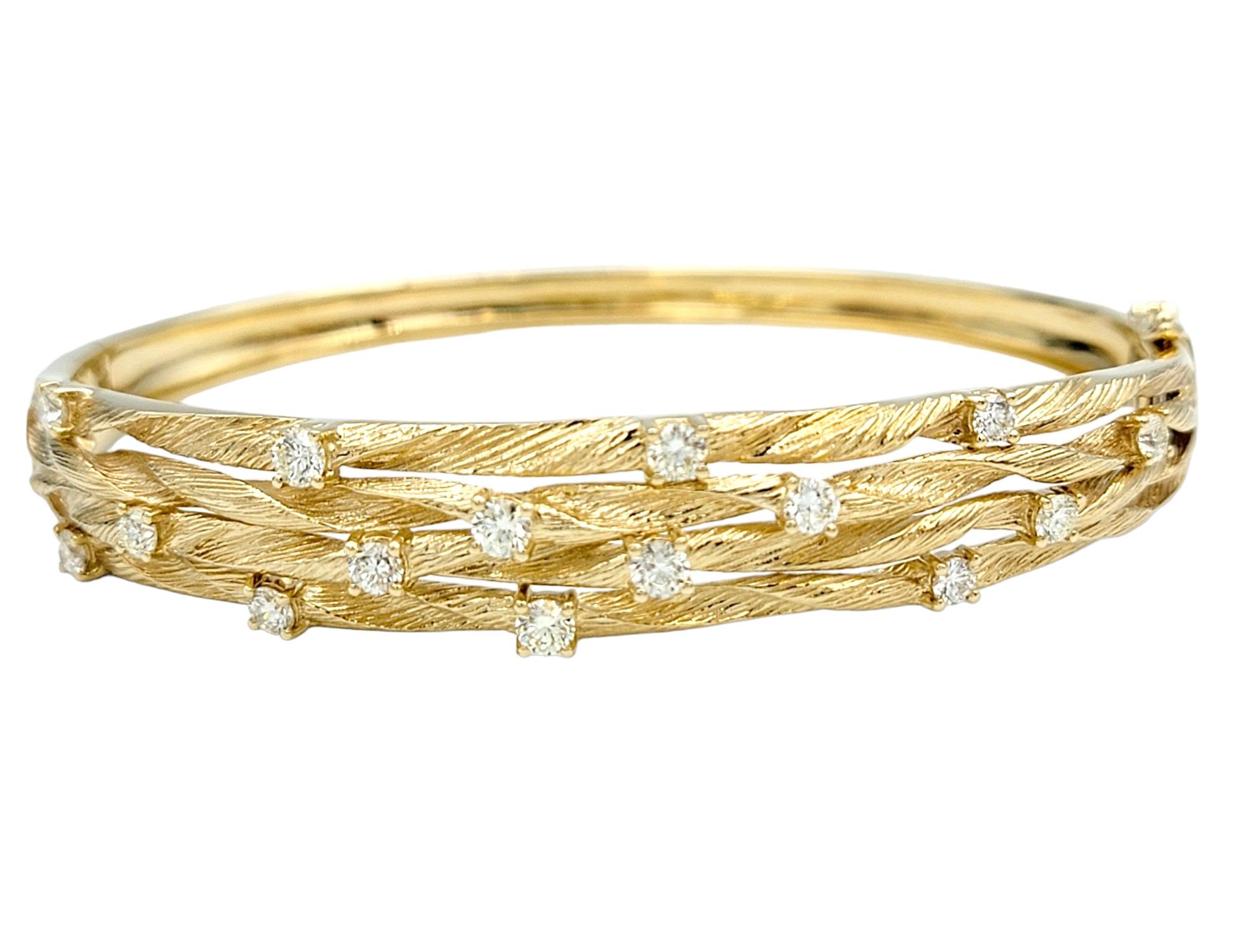 This Effy bangle bracelet, a part of the stunning D'Oro Collection, presents a seamless merge of classic design with a touch of contemporary allure. Crafted in lustrous 14 karat yellow gold, this bangle exudes a timeless elegance. The defining