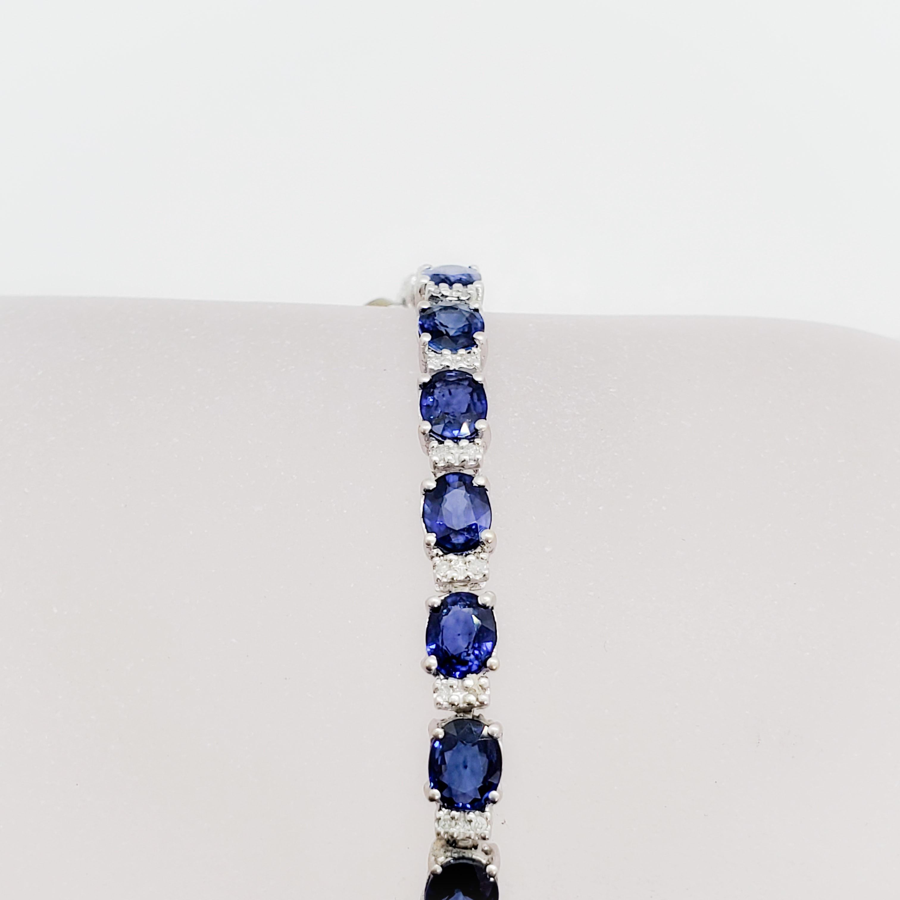 Beautiful classic Effy estate blue sapphire oval and white diamond round bracelet in 14k white gold. Blue sapphire ovals are bright and deep blue weighing 6.76 cts and white diamonds are bright and clean weighing 1.00 cts. Perfect for stacking or