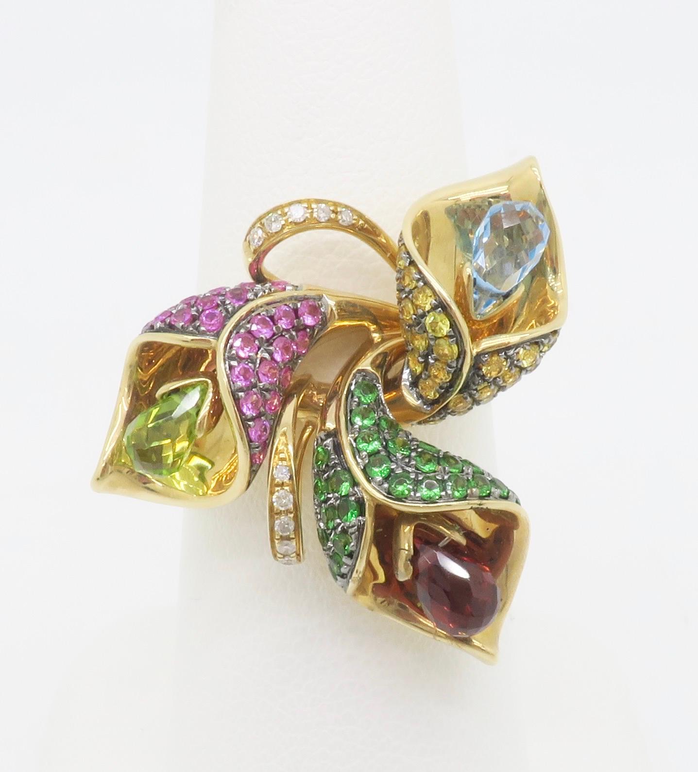 Rare EFFY gemstone floral ring crafted with moveable Briolette cut stones. 

Gemstone: Citrine, Peridot, Pink Sapphire, Garnet, Blue Topaz, Diamond
Diamond Carat Weight: .10CTW
Diamond Cut: Round Cut 
Metal: 14K Yellow Gold 
Marked/Tested: Marked
