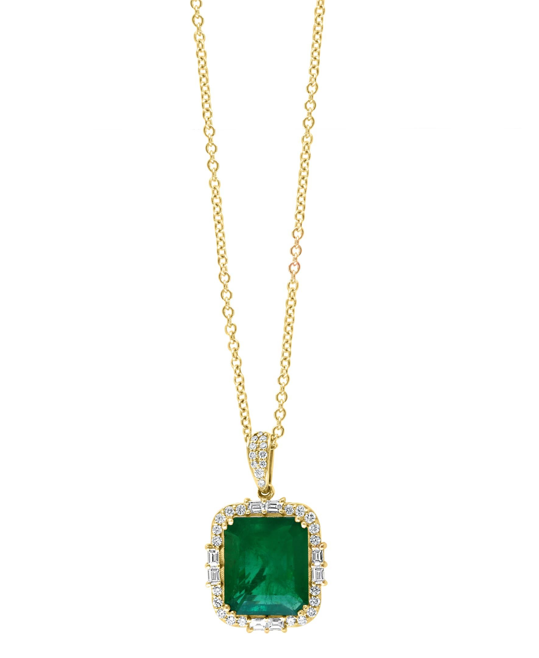 This Effy Hematian design pendant is set in 14K yellow gold. 
The Emerald is emerald cut in shape and the weight is 11.69 ct.
The diamonds are round & baguette in shape and the total weight is 1.31 ct.
The chain on this pendant is 18 inches in