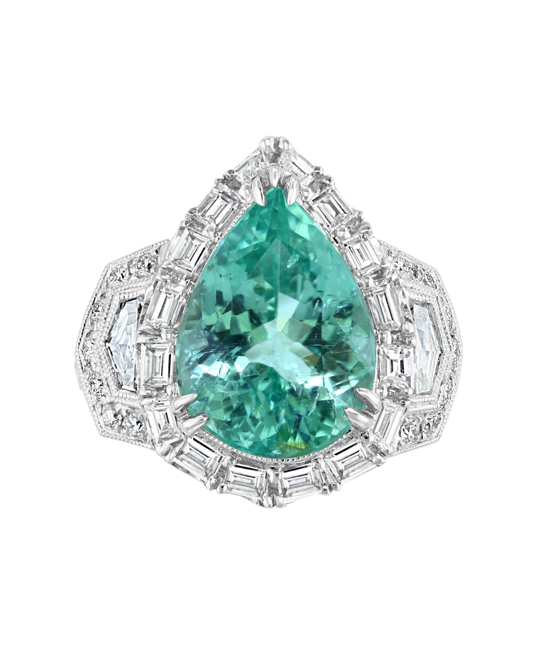 A center stone that shines like a teal blue sea.
This Effy Hematian design ring is set in 18K White gold. Featuring for the center stone a Pear shape Paraiba Tourmaline with a weight of 6.85 ct.
Surrounded by round cut Diamonds weighing 0.50 ct.,