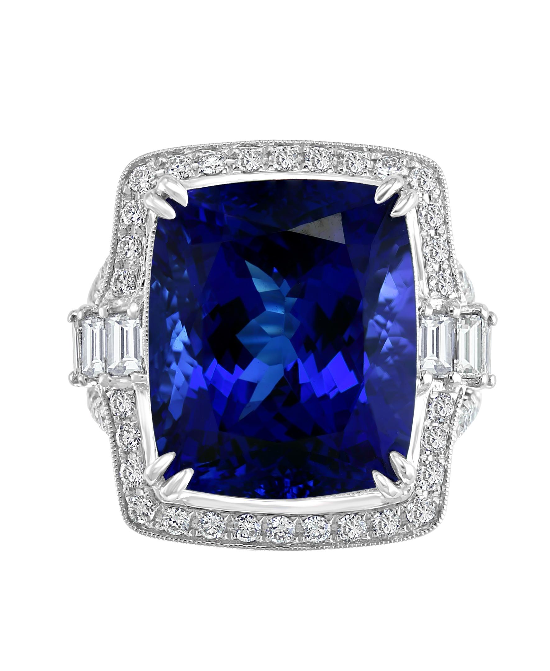 This ring is rich in design all around, with a significant center stone Tanzanite with a deep hue. 
This Effy Hematian design ring is set in 18K White gold. The center stone is a cushion cut Tanzanite that weights 23.84 ct. 
Surrounded by a