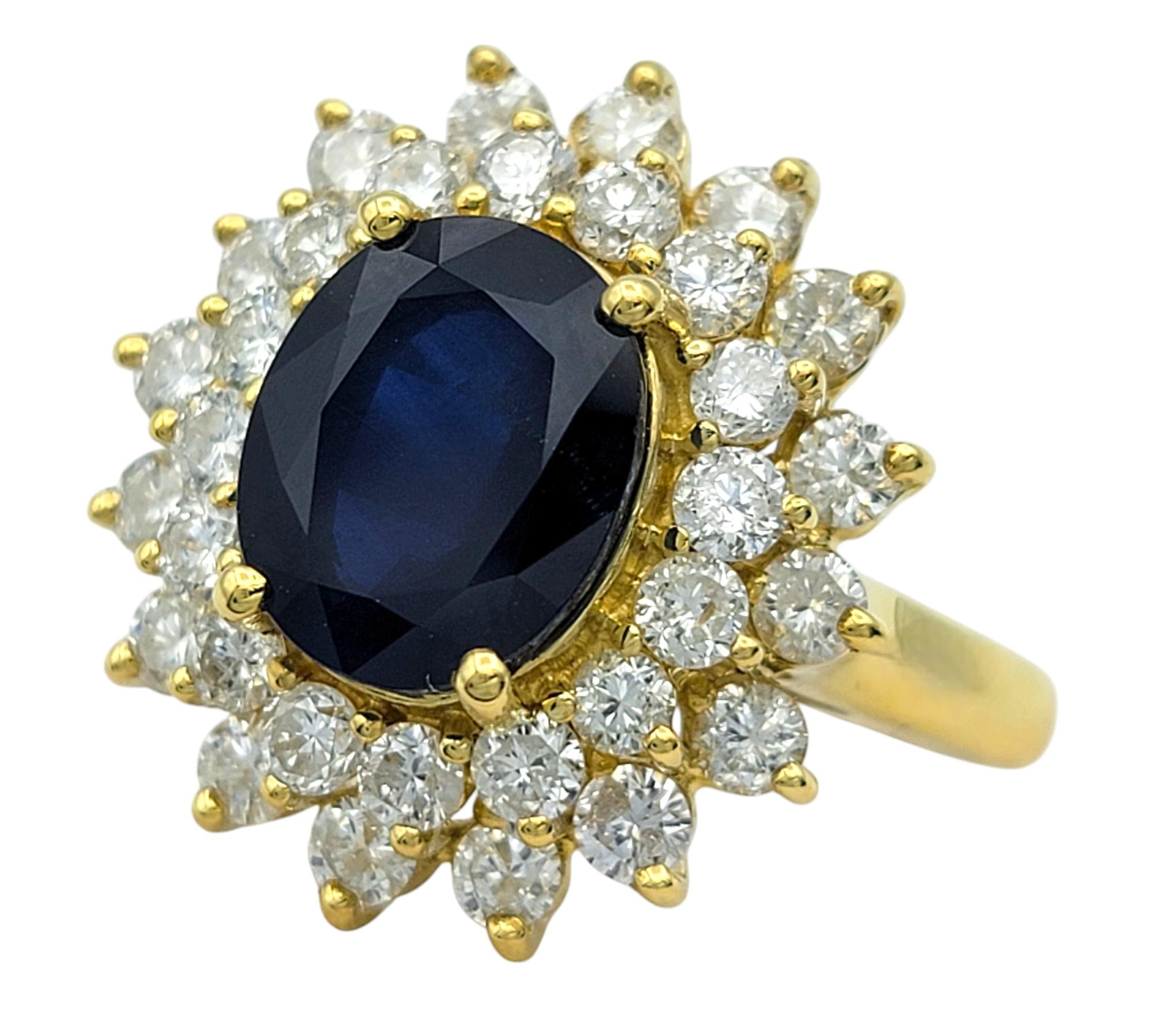 Contemporary Effy Oval Cut Sapphire and Double Diamond Halo Cocktail Ring in 18 Karat Gold For Sale