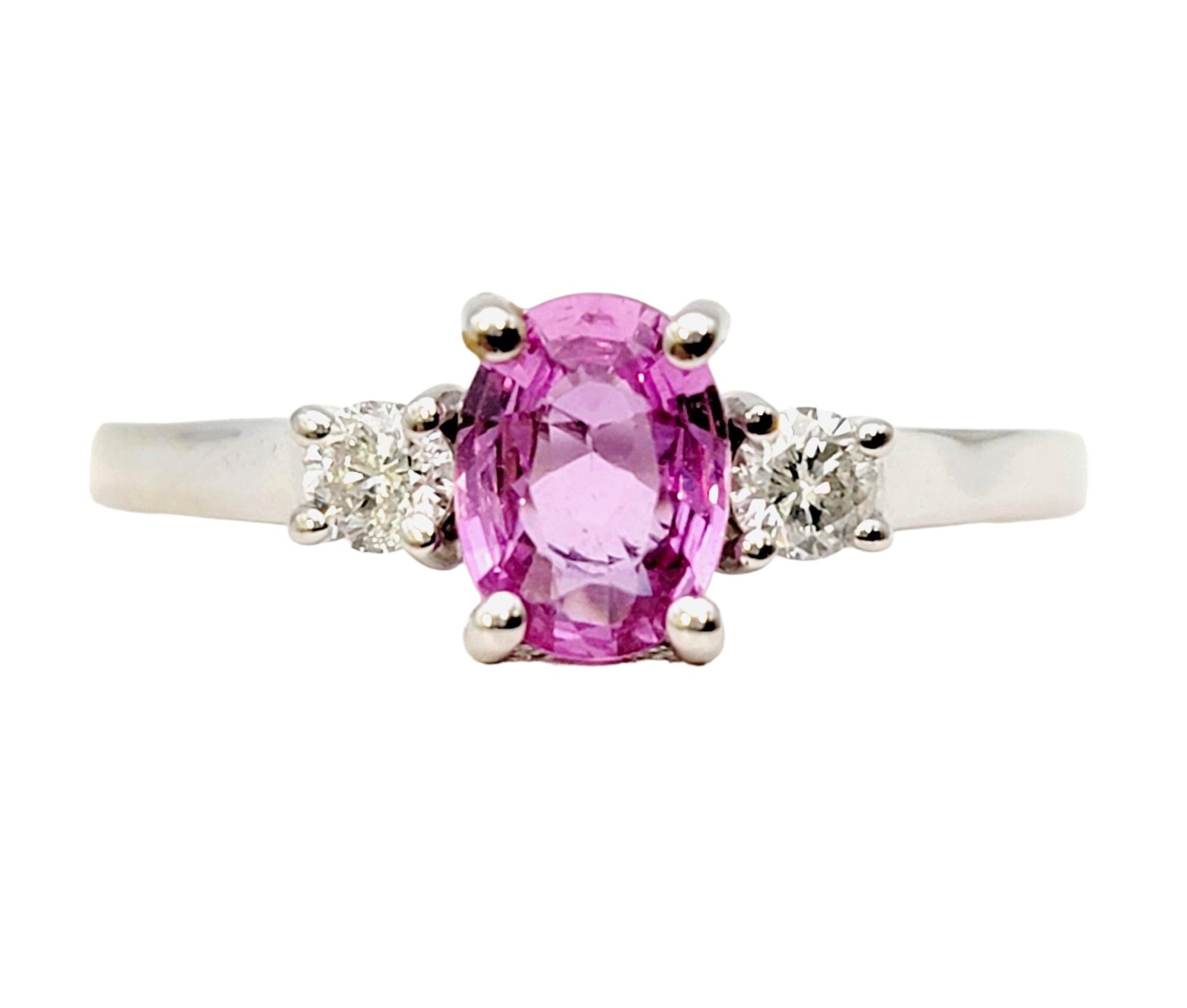Ring size: 8.75

Pretty in pink! This beautiful three stone ring from Effy combines the allure of pink sapphires, sparkling diamonds, and luxurious 14K white gold to create a true timeless treasure.

The center stone of this gorgeous ring boasts a